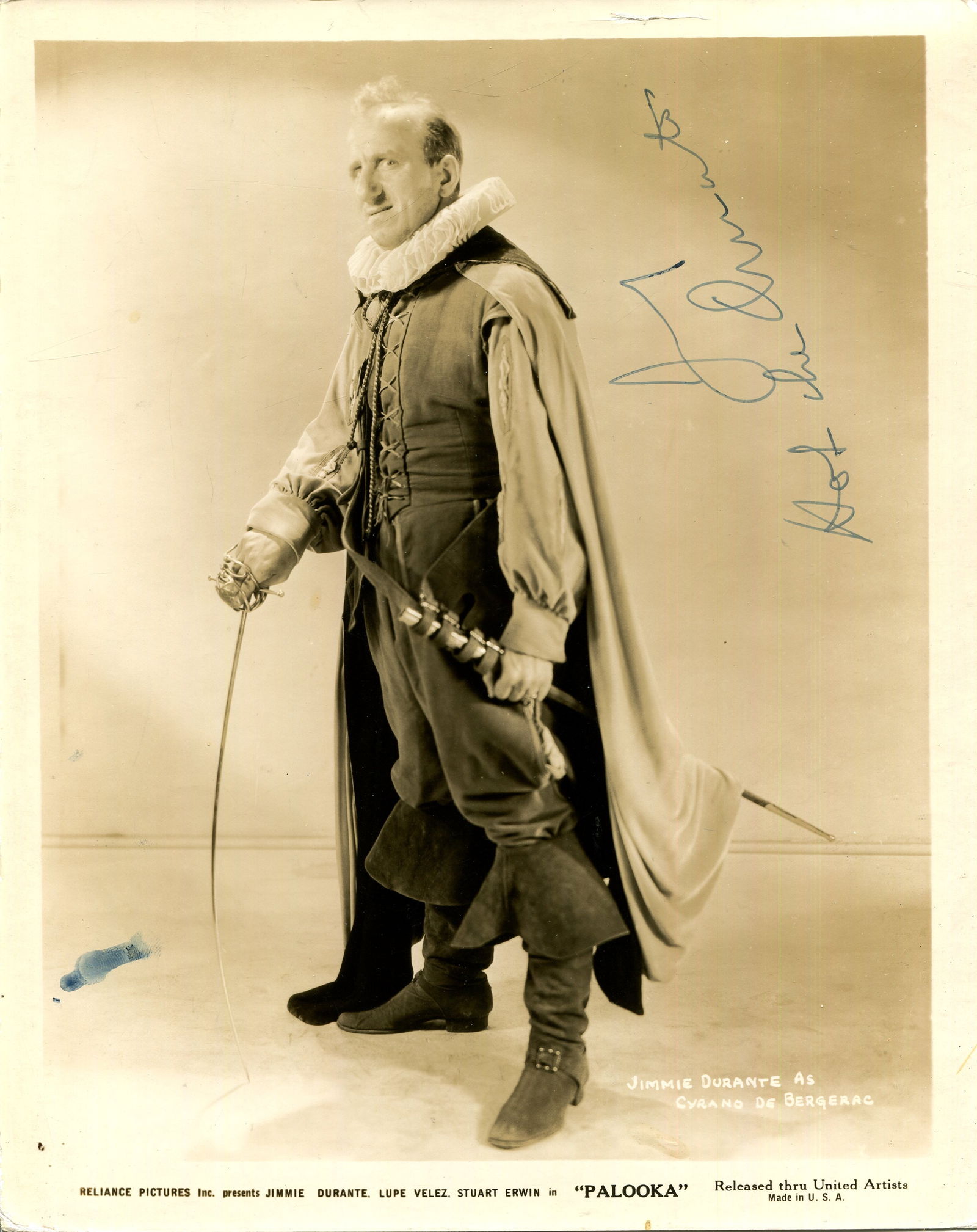 DURANTE JIMMY: (1893-1980): DURANTE JIMMY: (1893-1980) American actor and comedian. A good vintage signed sepia 8 x 10 photograph of Durante standing in a full-length pose in costume as Cyrano de Bergerac from the American comed