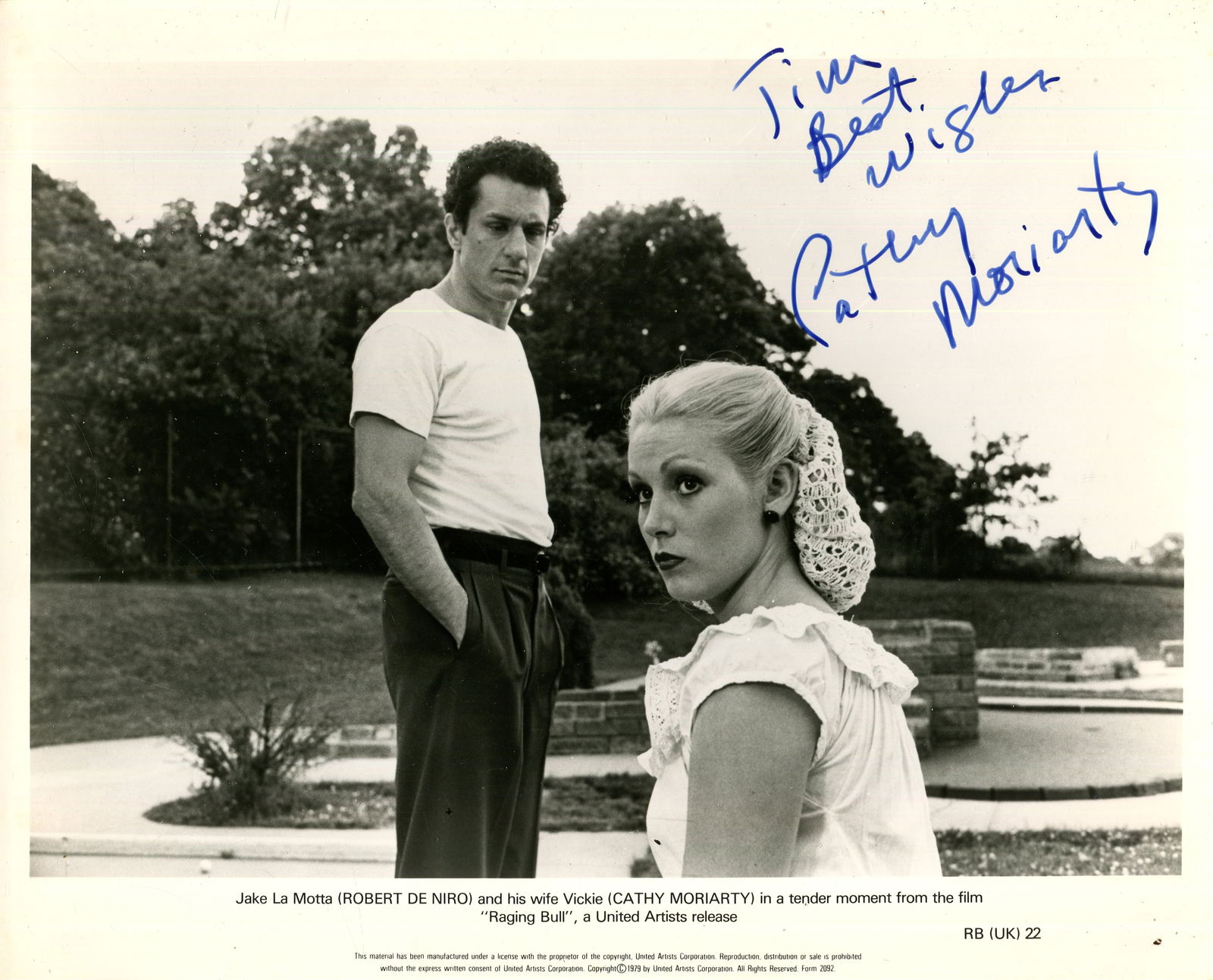 MORIARTY CATHY: (1960- ): MORIARTY CATHY: (1960- ) American actress. Signed and inscribed 10 x 8 photograph of Moriarty seated outdoors in a head and shoulders pose, in costume as Vickie LaMotta, with actor Robert De Niro stan