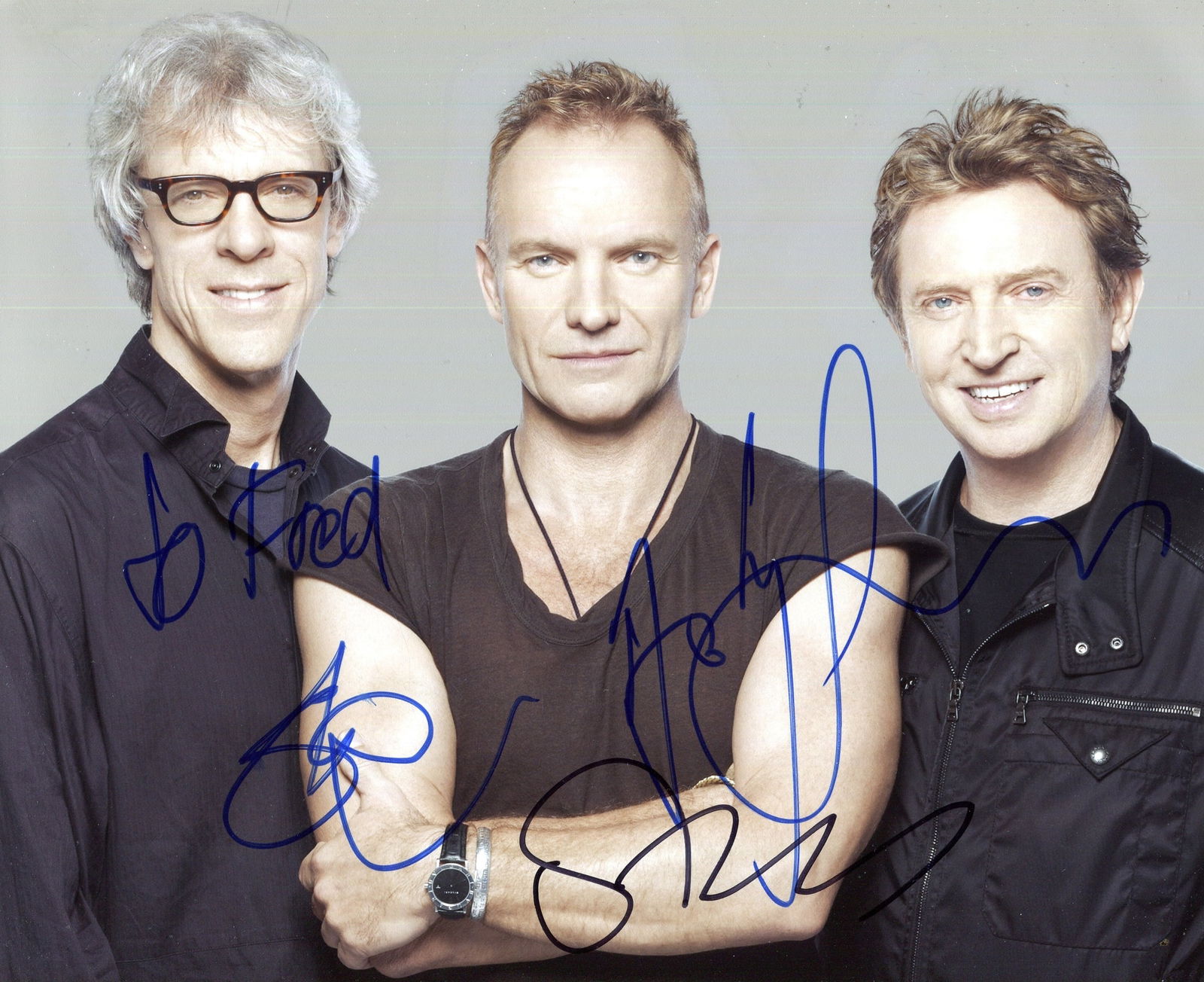 POLICE THE:: POLICE THE: English rock band. Signed and inscribed colour 10 x 8 photograph by all three members of the English rock band The Police, the image depicting the musicians standing in half-length poses.