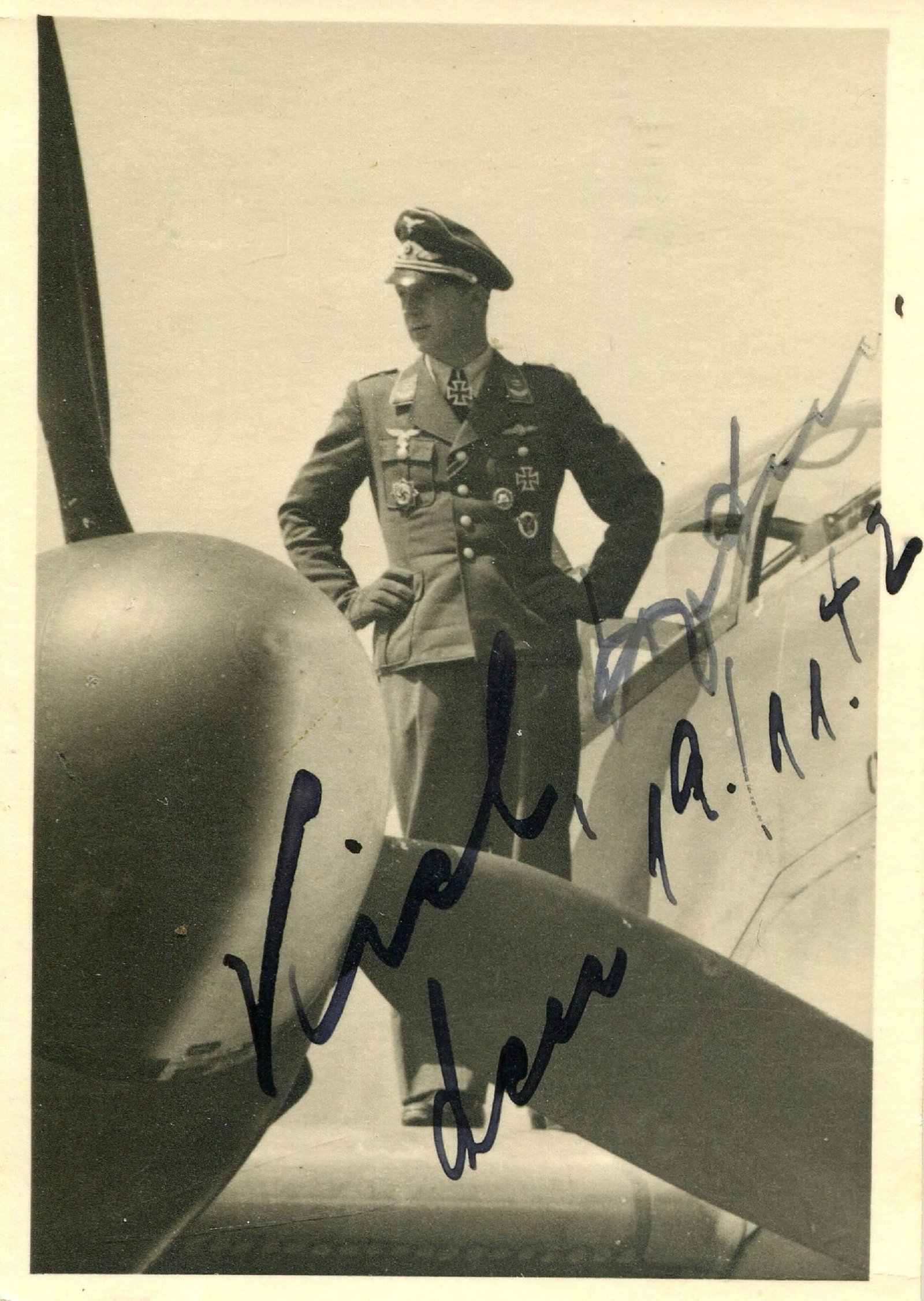 KIEL JOHANNES: (1912-1944): KIEL JOHANNES: (1912-1944) German Luftwaffe ace of World War II, credited with 25 aerial victories. Knight´s Cross winner. Vintage signed 2 x 3 photograph of Kiel standing in a full-length pose, wear
