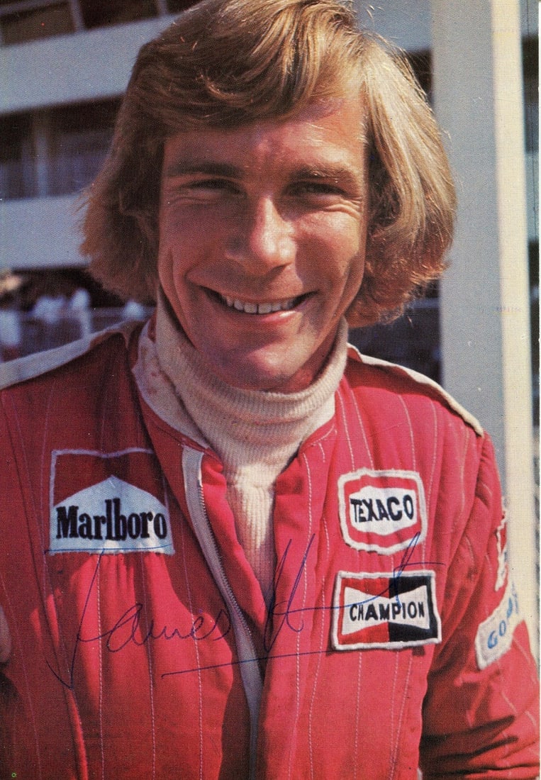 HUNT JAMES: (1947-1993): HUNT JAMES: (1947-1993) British motor racing driver, Formula One World Champion 1976. Signed colour 4 x 6 postcard photograph of Hunt in a smiling head and shoulders pose wearing his red Marlboro