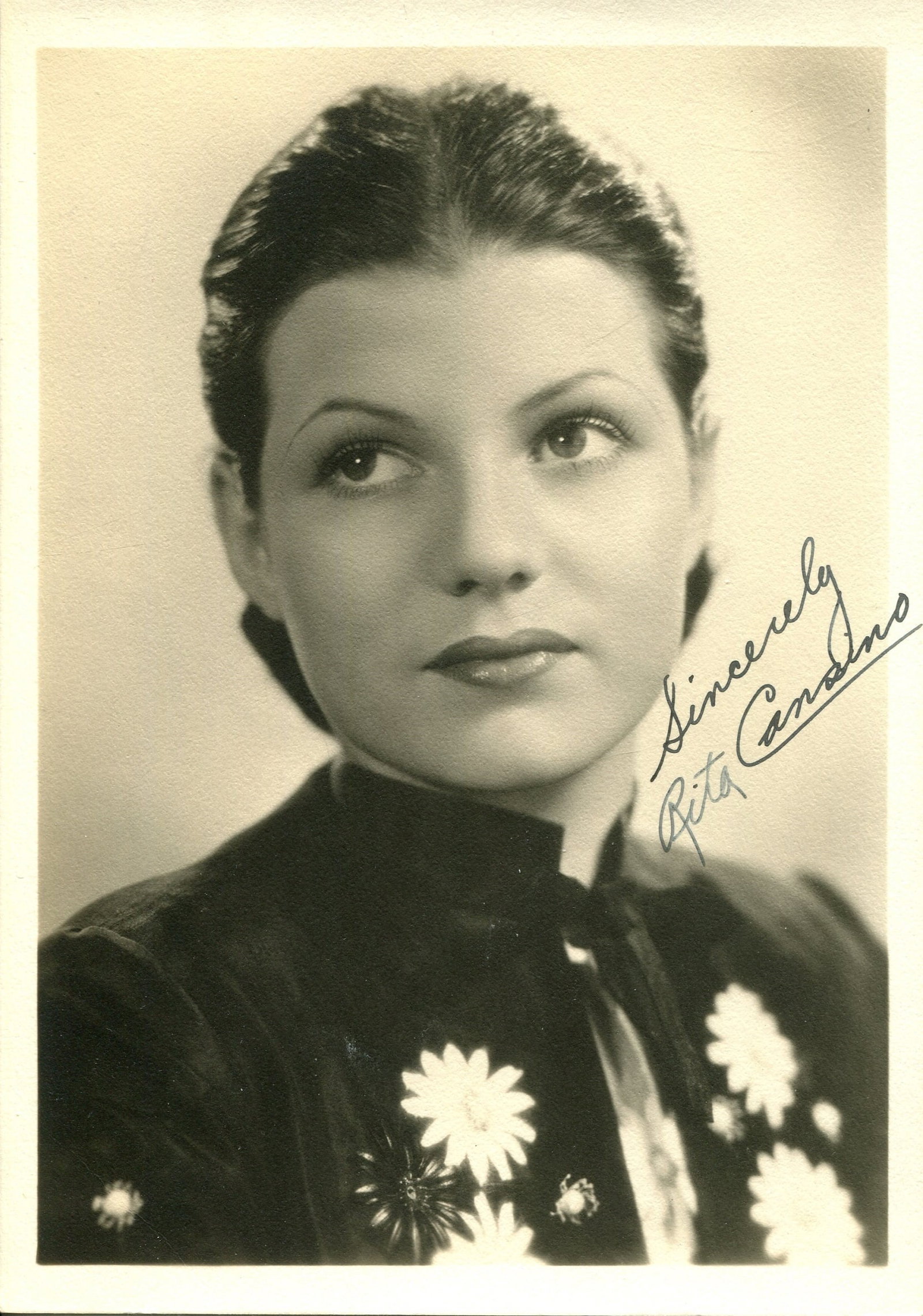 HAYWORTH RITA: (1918-1987): HAYWORTH RITA: (1918-1987) American actress. A rare, early vintage signed sepia 5 x 7 photograph of the attractive actress in a head and shoulders pose. Signed (´Sincerely, Rita Cansino´) with her