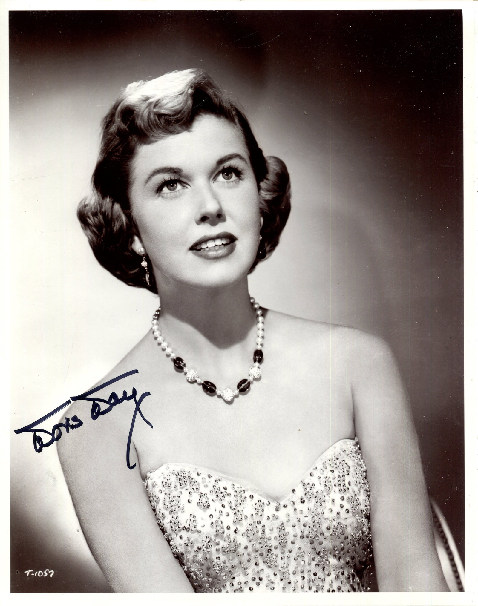 DAY DORIS: (1922-2019): DAY DORIS: (1922-2019) American actress and singer. Signed 8 x 10 photograph of Day in a half-length pose. Signed in bold black ink to a clear area of the image. VG