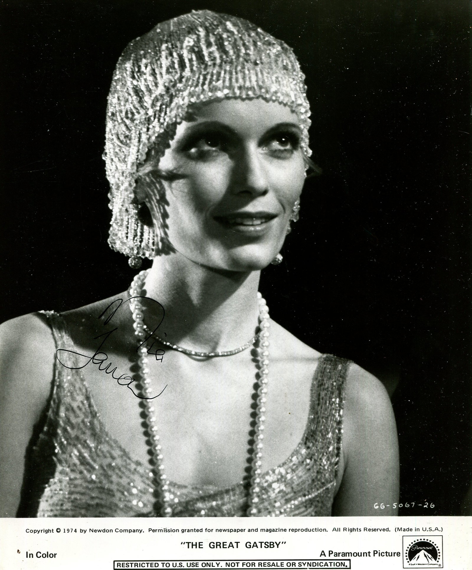 FARROW MIA: (1945- ): FARROW MIA: (1945- ) American actress. Signed 8 x 10 photograph of Farrow in a head and shoulders pose, the promotional Paramount Picture image depicting her in costume as Daisy Buchanan from the