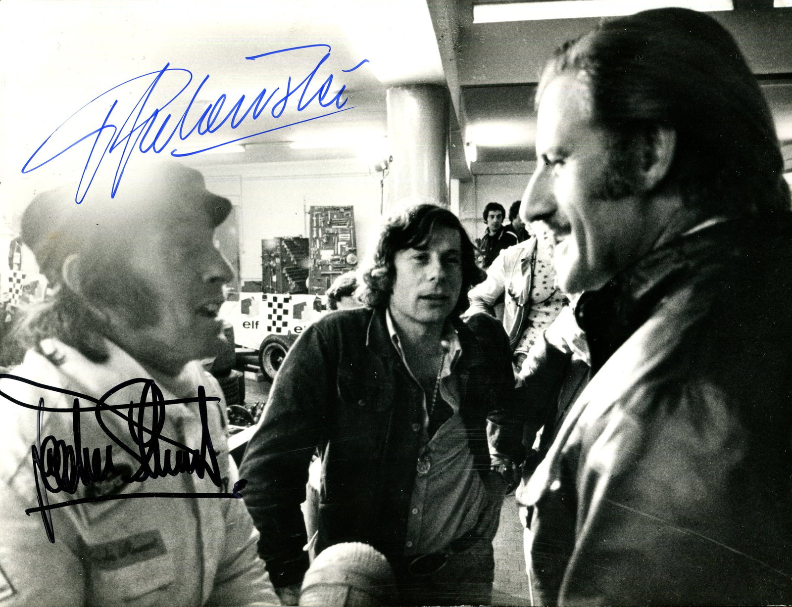 WEEKEND OF A CHAMPION:: WEEKEND OF A CHAMPION: An unusual signed 9.5 x 7 photograph by both the director Roman Polanski and British Formula One World Champion motor racing driver Jackie Stewart individually, the image