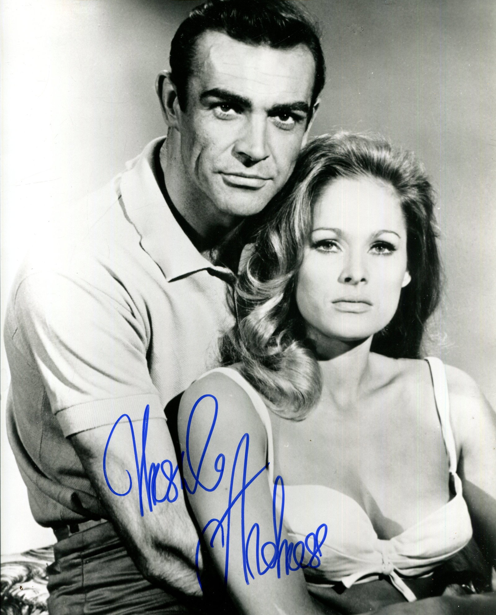 ANDRESS URSULA: (1936- ): ANDRESS URSULA: (1936- ) Swiss-German actress, famous for her role as Honey Ryder in the first James Bond film, Dr. No (1962). Signed 8 x 10 photograph of the actress in a half-length pose in costume