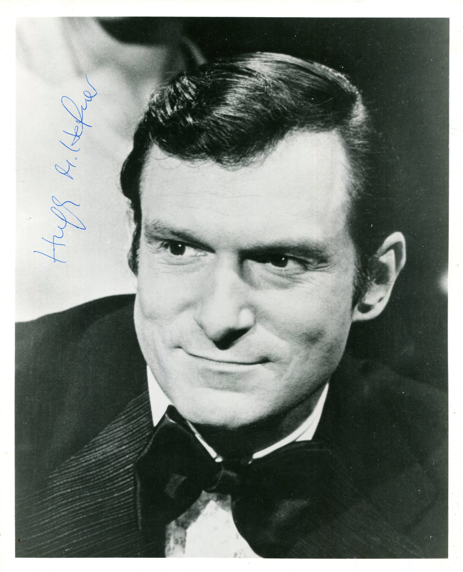 HEFNER HUGH: (1926-2017): HEFNER HUGH: (1926-2017) American magazine publisher, the founder and editor-in-chief of Playboy magazine. Signed 8 x 10 photograph of Hefner in a head and shoulders pose. Signed in blue ink with his