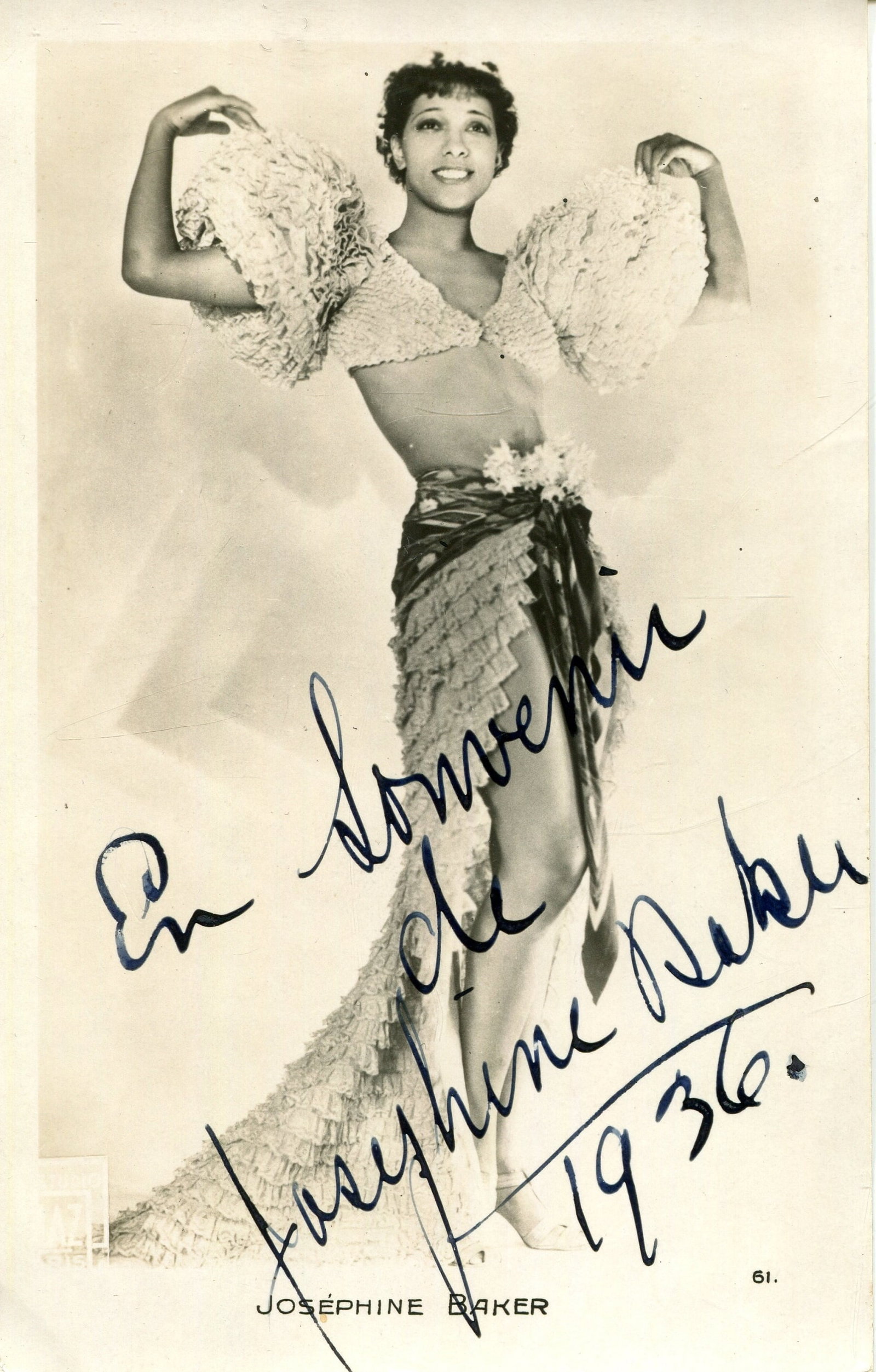 BAKER JOSEPHINE: (1906-1975): BAKER JOSEPHINE: (1906-1975) American-born French entertainer. Vintage signed 3.5 x 5.5 postcard photograph of Baker standing in an appealing full-length pose. Photograph by Studio Piaz of Paris.