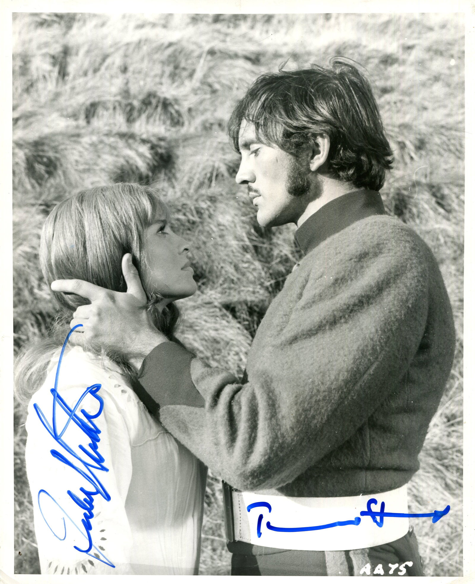 FAR FROM THE MADDING CROWD:: FAR FROM THE MADDING CROWD: Signed 8 x 10 photograph by both Terence Stamp (Frank Troy) and Julie Christie (Bathsheba Everdene) individually, the image depicting the two actors standing opposite o
