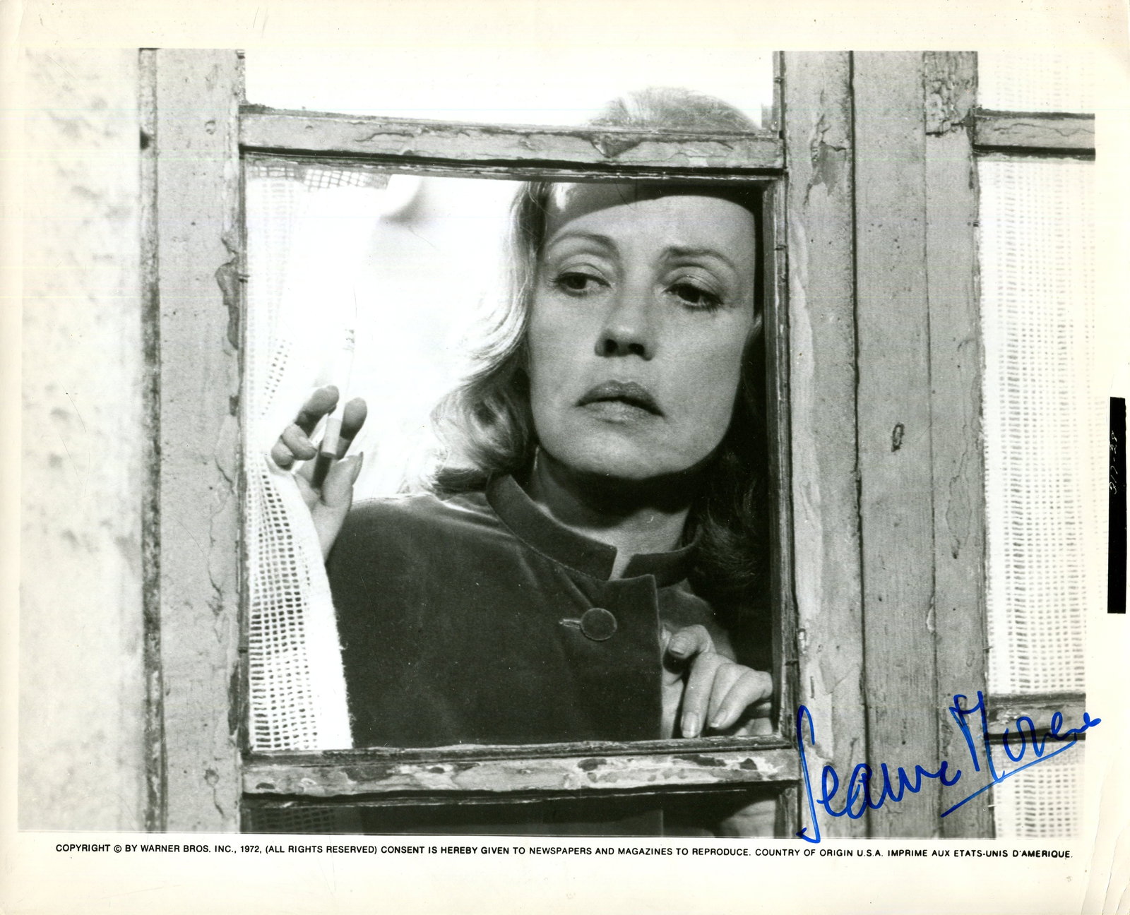 MOREAU JEANNE: (1928-2017): MOREAU JEANNE: (1928-2017) French actress. Signed 10 x 8 photograph of Moreau in a head and shoulders pose, behind the glass of a window, in costume as The Other Woman, from the Marguerite Duras´ Fre