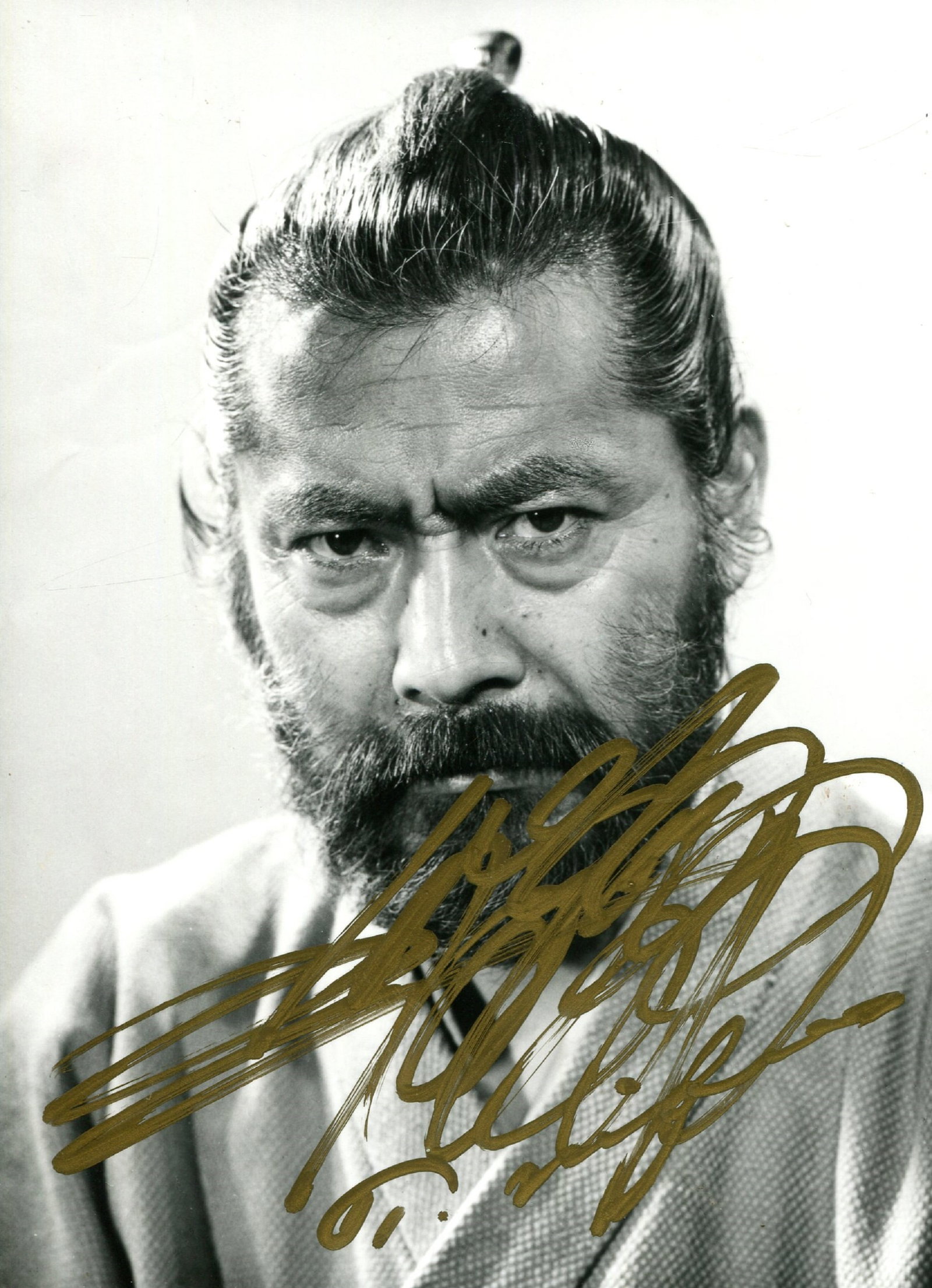 MIFUNE TOSHIRO: (1920-1997): MIFUNE TOSHIRO: (1920-1997) Japanese actor, famous for his roles in Akira Kurosawa’s jidaigeki films. Signed 4.5 x 6.5 photograph of Mifune in a head and shoulders pose in costume as a samurai.