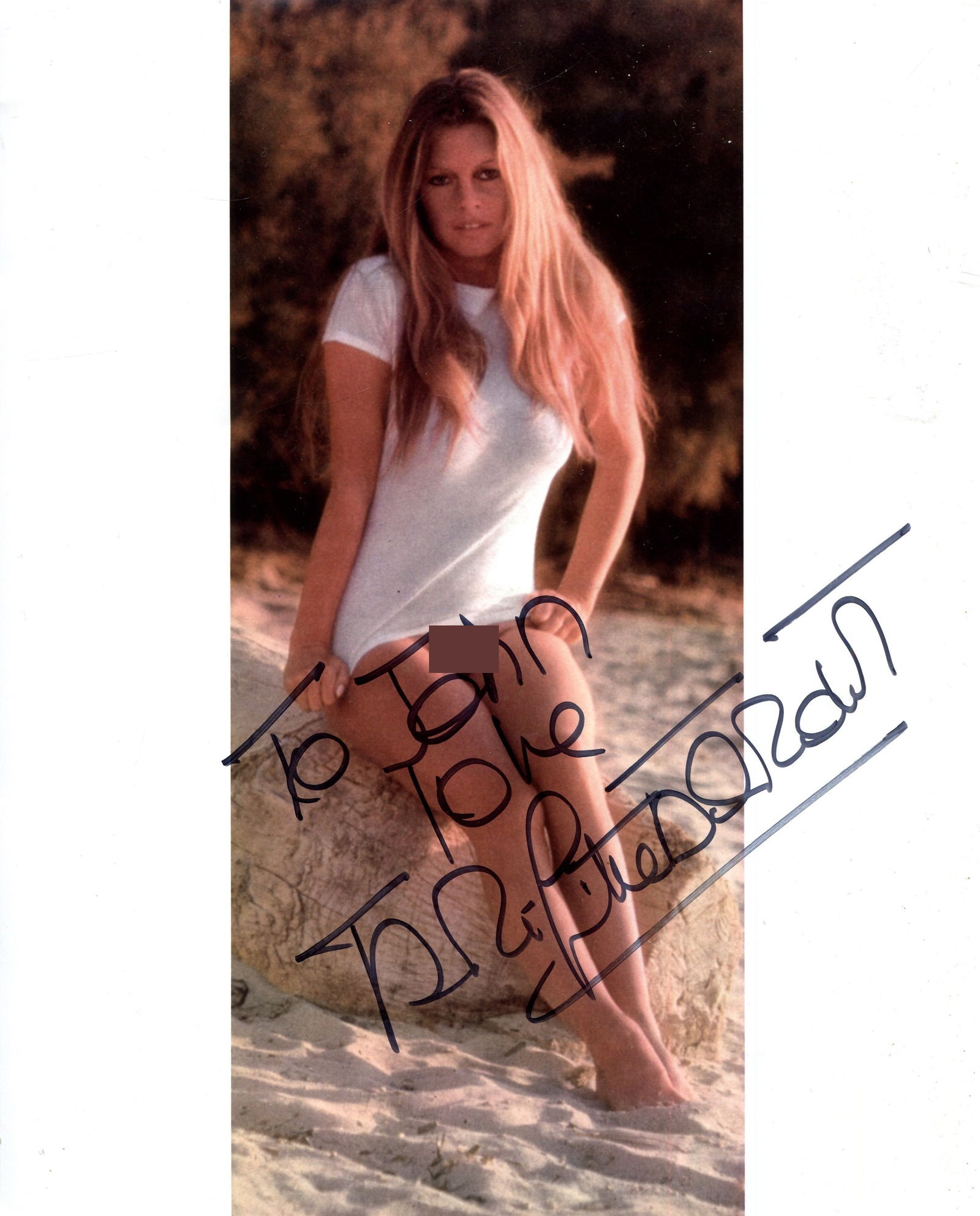 BARDOT BRIGITTE: (1934-2025): BARDOT BRIGITTE: (1934-2025) French Actress & Sex Symbol. A good signed and inscribed colour 8 x 10 photograph `Love, Brigitte Bardot´, the image depicting Bardot outdoors, on the beach, seated