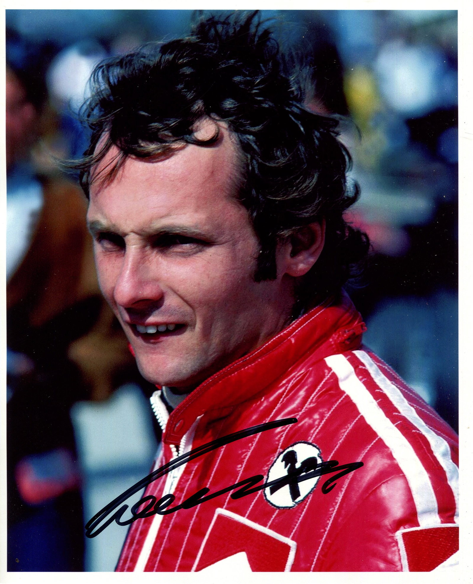 LAUDA NIKI: (1949-2019): LAUDA NIKI: (1949-2019) Austrian Motor Racing Driver, Formula One World Champion 1975, 1977 & 1984. Signed colour 8 x 10 photograph of Lauda in a head and shoulders pose, wearing his Ferrari racin