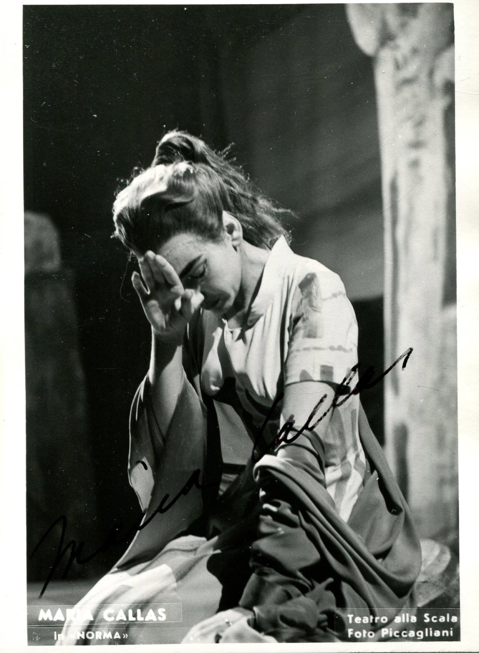 CALLAS MARIA: (1923-1977): CALLAS MARIA: (1923-1977) American-born Greek soprano. Vintage attractive signed 4 x 5.5 photograph of Callas kneeling on scene in a full length pose, in costume as Norma from Vincenzo Bellini's