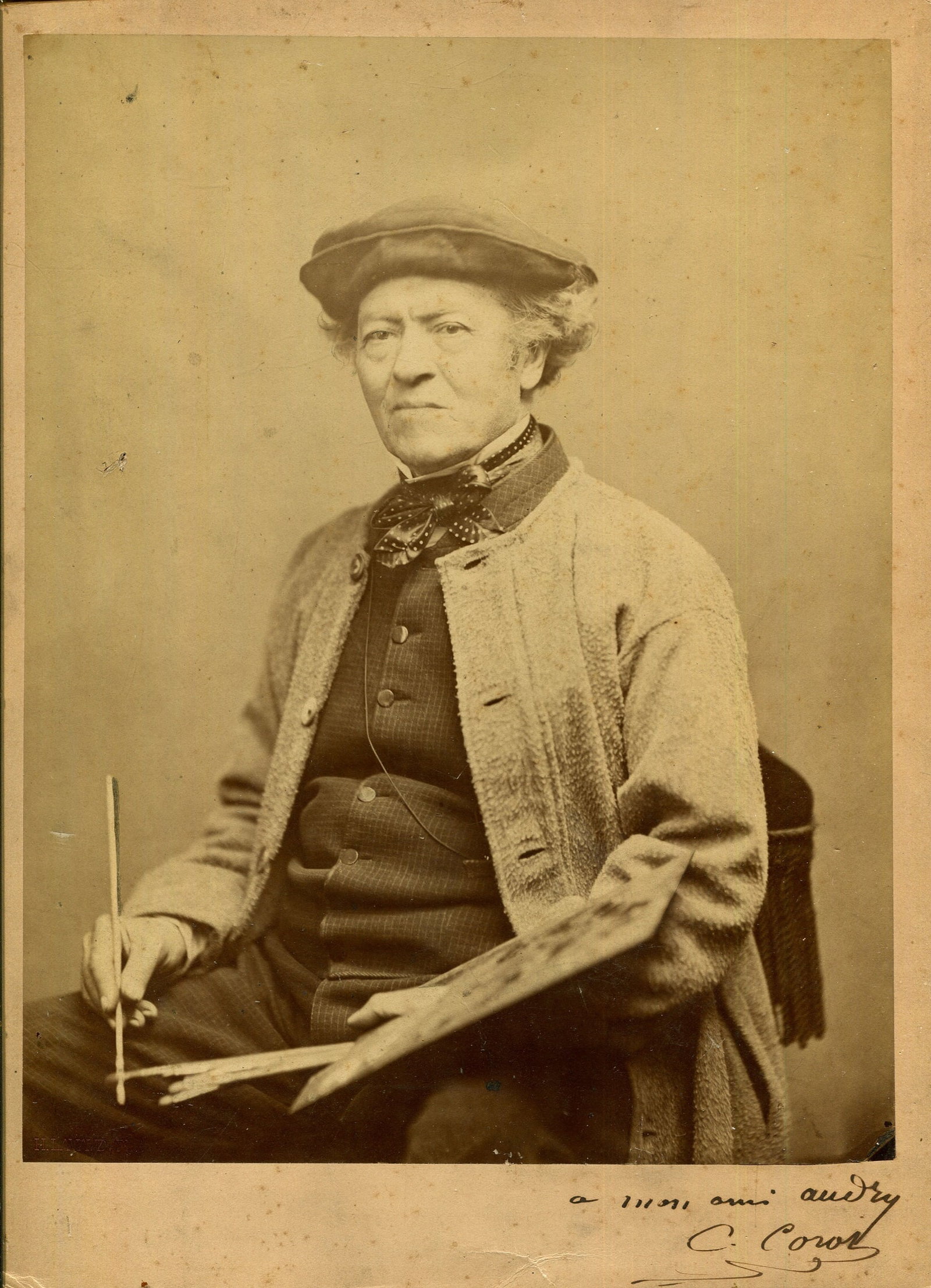 COROT JEAN-BAPTISTE: (1796-1875): COROT JEAN-BAPTISTE: (1796-1875) French Painter. A rare and excellent signed and inscribed large 8 x 10 sepia photograph by Corot. The card photograph image depicting the French Painter seated, in a t