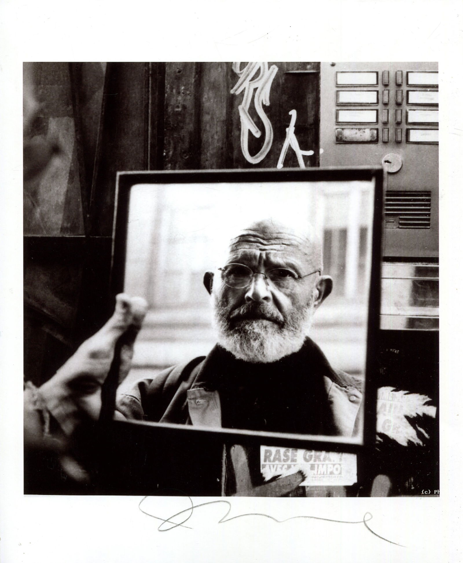DINE JIM: (1935- ): DINE JIM: (1935- ) American artist. Artistic signed 8 x 10 photograph of Dine in a head and shoulders pose, the attractive image showing him, watching himself on a mirror he holds. Signed in dark