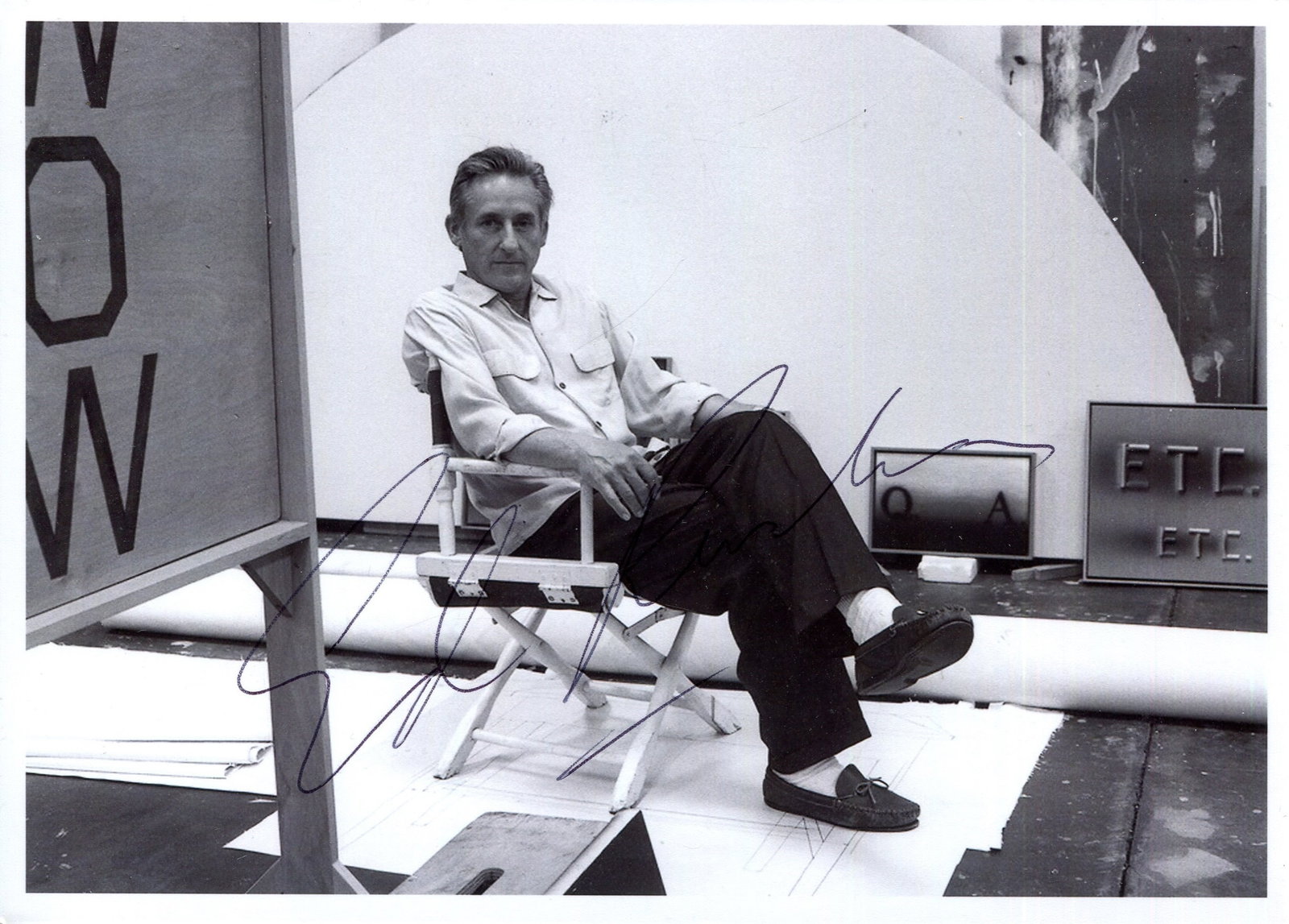 RUSCHA EDWARD: (1937- ): RUSCHA EDWARD: (1937- ) American Artist, associated to the Pop Art movement. Signed 7 x 5 photograph `Ed Ruscha´, the image depicting the multi-faceted artist setaed in a full-length pose in his work