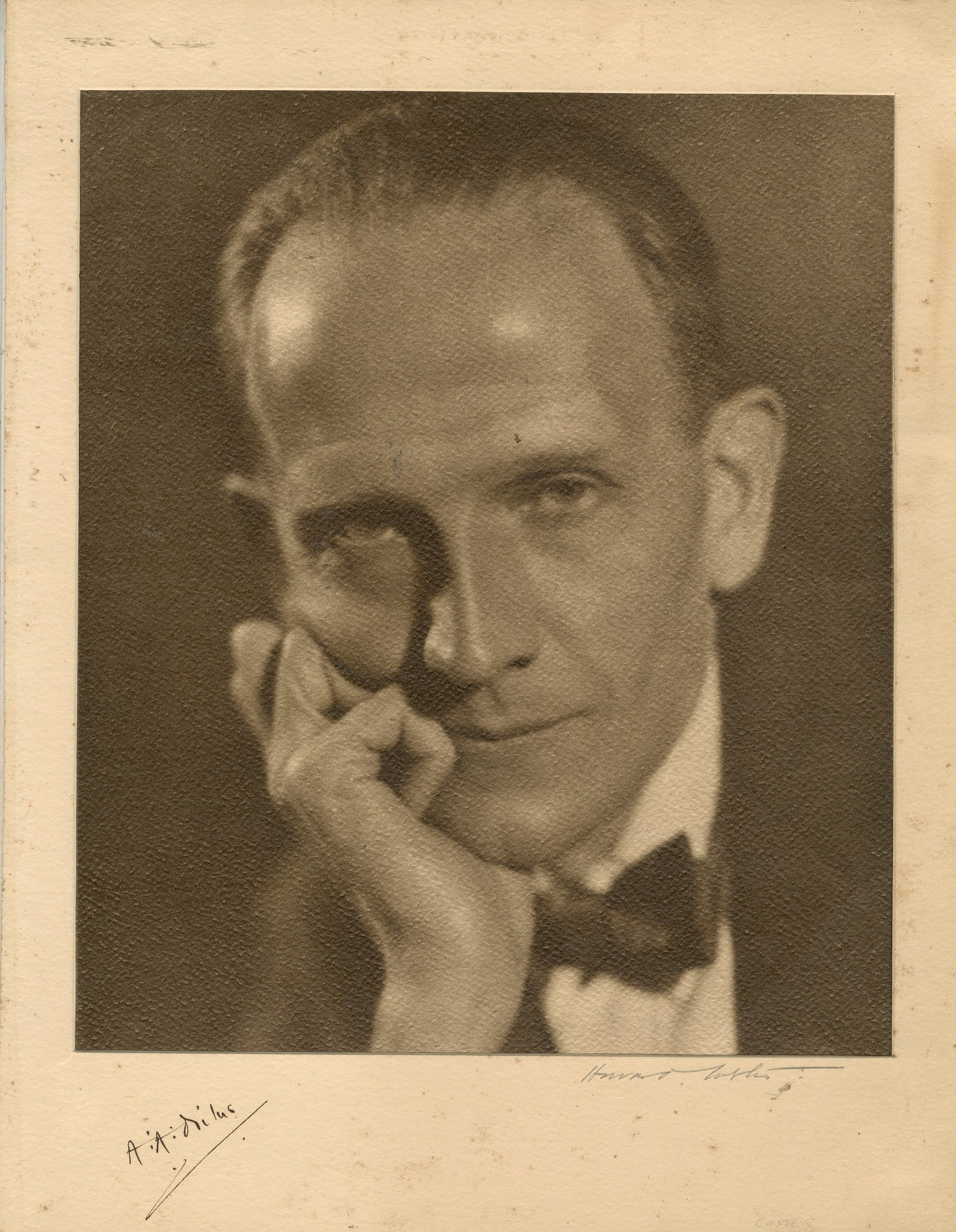 MILNE A. A.: (1882-1956): MILNE A. A.: (1882-1956) English author, creator of Winnie-the-Pooh. A good vintage signed sepia 10 x 13 photograph of Milne in an engaging close-up head and shoulders pose resting his chin on one