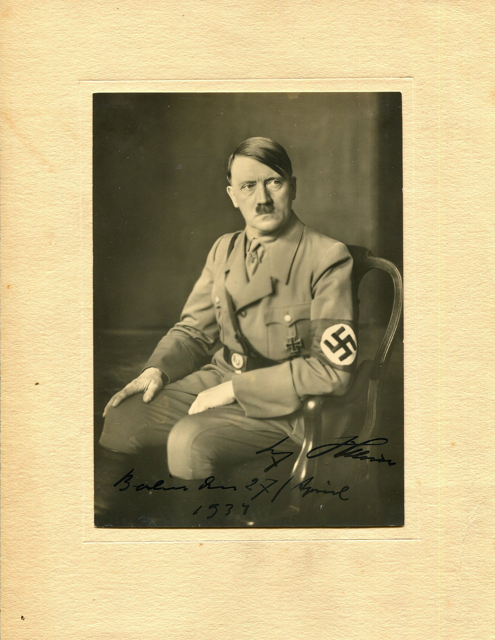 HITLER ADOLF: (1889-1945): HITLER ADOLF: (1889-1945) Fuhrer of the Third Reich 1933-45. A good vintage signed 7.5 x 10 photograph, the studio portrait (approximately 12 x 16.5 cm) depicting Hitler seated in a three-quarter