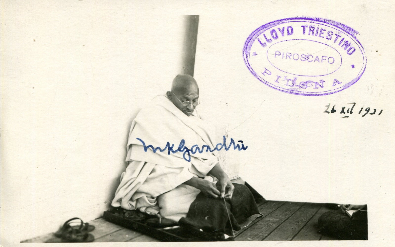 GANDHI MAHATMA: (1869-1948) A highly symbolic signed photograph: GANDHI MAHATMA: (1869-1948) Indian political and spiritual leader during the Indian independence movement. A very fine vintage signed postcard photograph by Gandhi, the symbolic image depicting the so