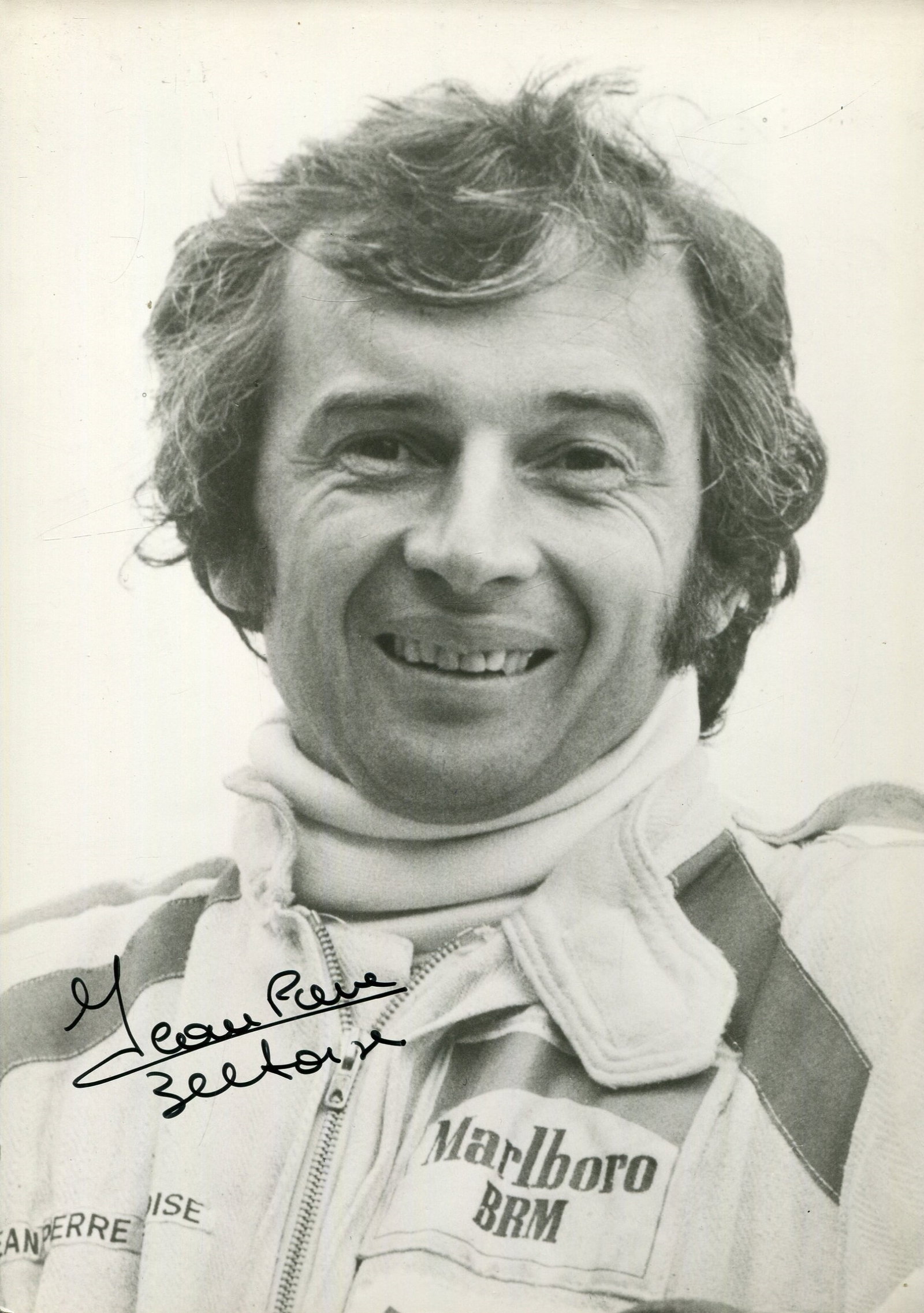 BELTOISE JEAN -PIERRE: (1937-2015): JEAN-PIERRE BELTOISE: (1937-2015) French Formula One Driver. Winner of the Monaco 1972 Grand Prix. Signed 5 x 7 photograph by Beltoise, the image depicting him in a head and shoulders pose wearing