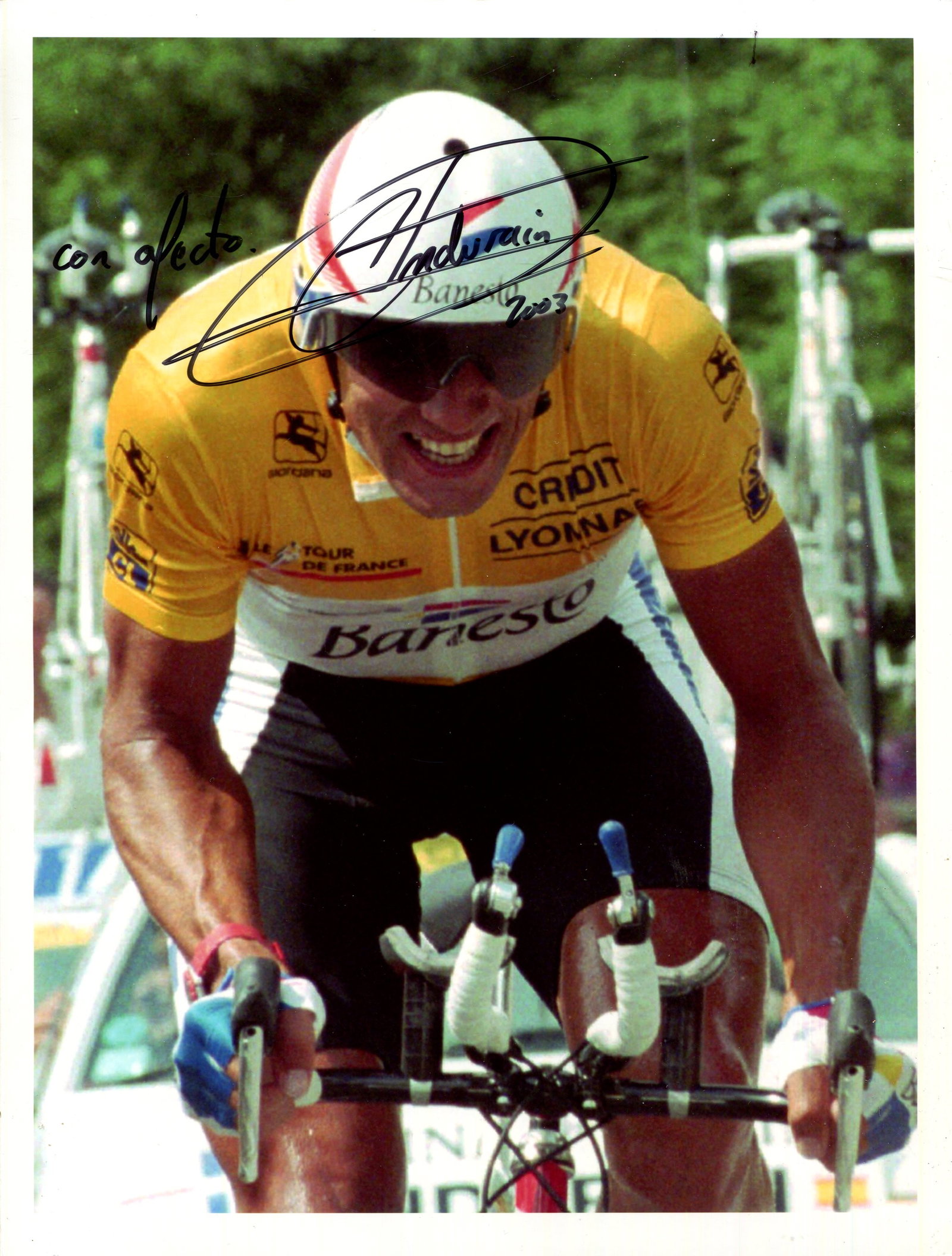INDURAIN MIGUEL: (1964- ): INDURAIN MIGUEL: (1964- ) Spanish Cyclist. Indurain won five consecutive Tour de France (1991-1995). Signed colour 8 x 11 photograph, the image depicting Indurain in a half-length cycling action pose