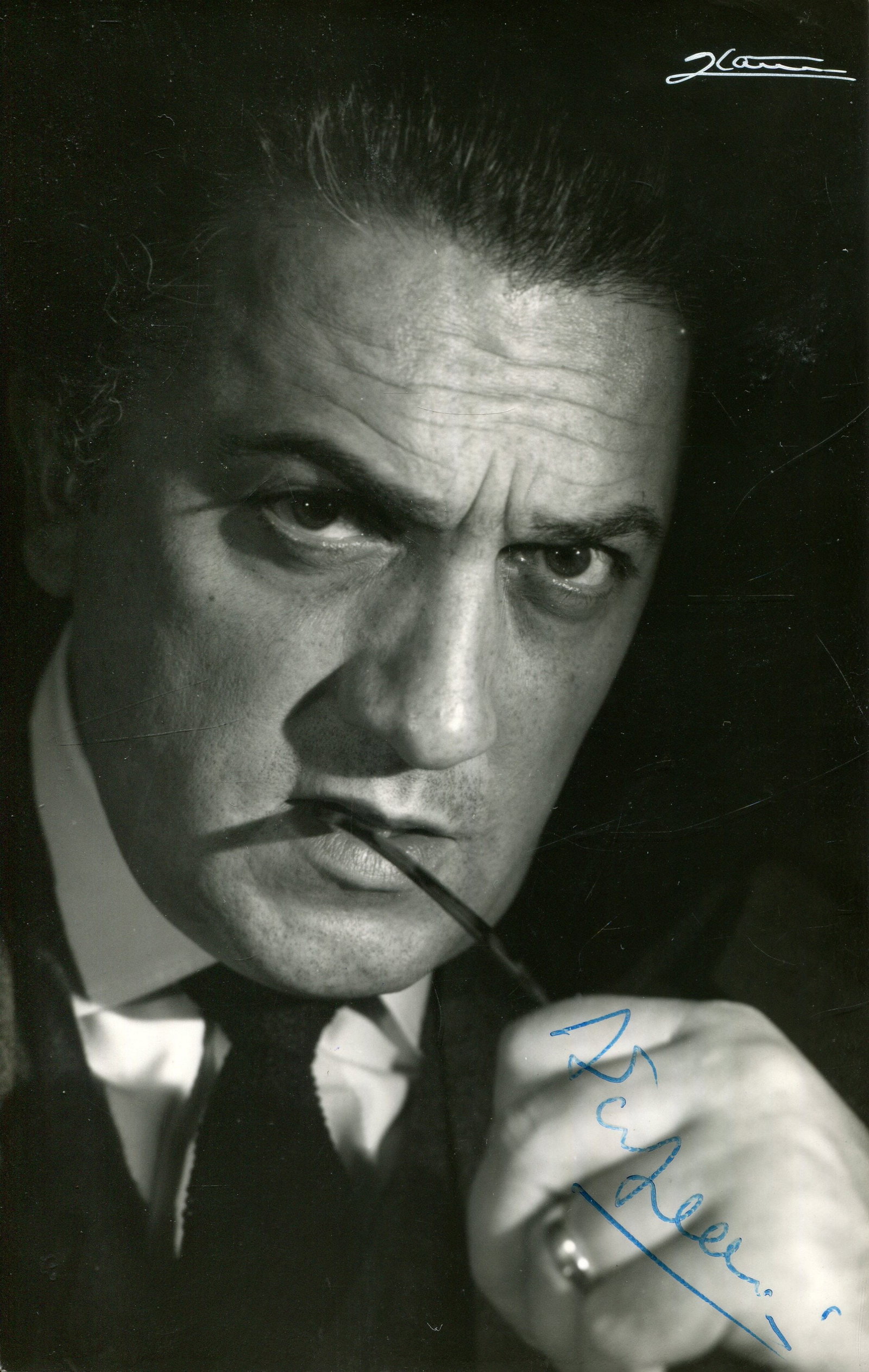 FELLINI FEDERICO: (1920-1993): FELLINI FEDERICO: (1920-1993) Italian film director, Academy Award winner. A good signed 3.5 x 5.5 photograph, the image depicting the awarded Italian film director in a close-up head and shoulders