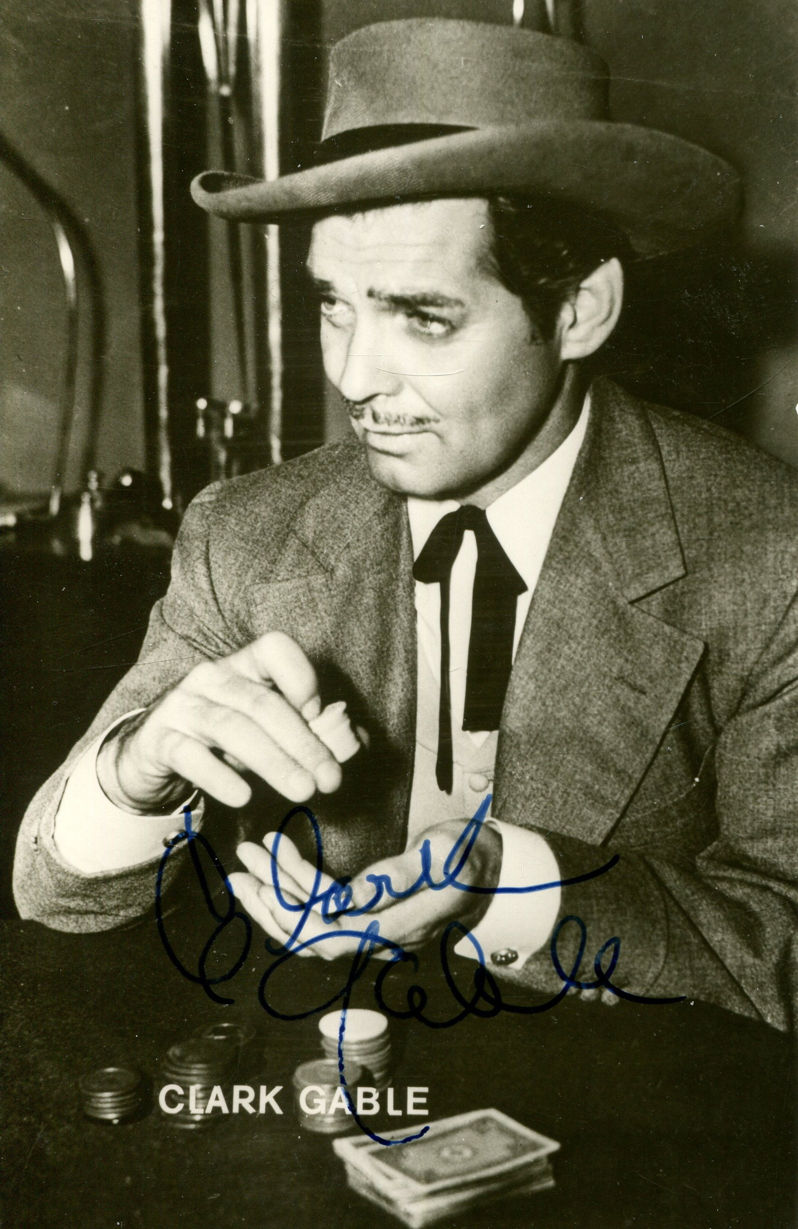 GABLE CLARK: (1901-1960): GABLE CLARK: (1901-1960) American actor, Academy Award winner for Best Actor in 1934 for his role as Peter Warne in It Happened One Night. Vintage signed 3.5 x 5.5 photograph of Gable seated in a