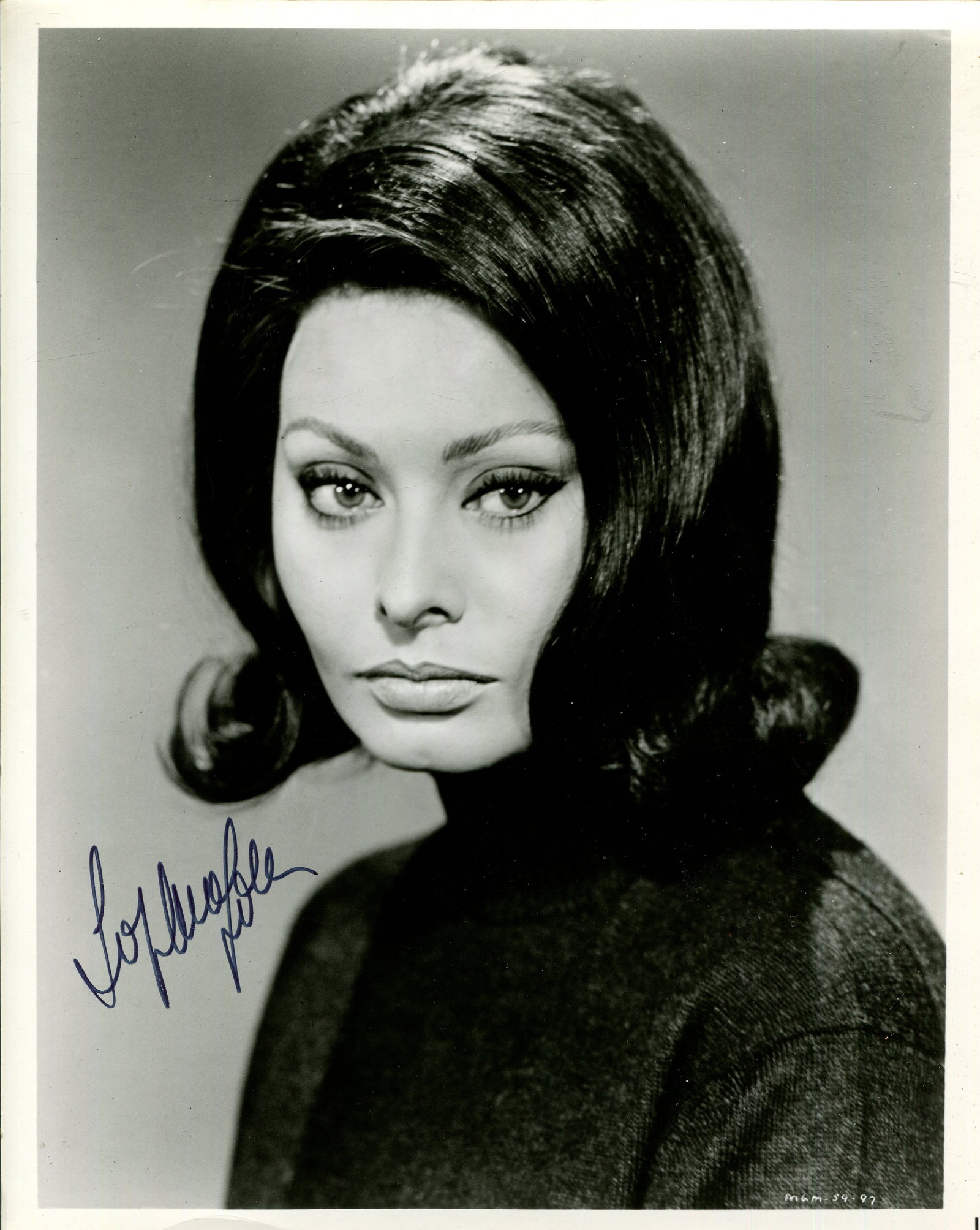 LOREN SOPHIA: (1934- ): LOREN SOPHIA: (1934- ) Italian actress, Academy Award winner for Best Actress in 1961 for her role as Cesira in La Ciociara. Signed 8 x 10 photograph of Loren in a head and shoulders pose in costume