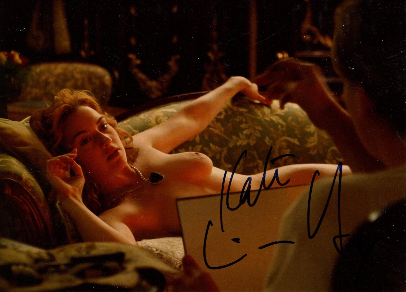 WINSLET KATE: (1975- ): WINSLET KATE: (1975- ) English actress, Academy Award winner. Signed colour 7 x 5 photograph, the attractive image depicting Winslet laying in a half-length nude pose, in a scene from Titanic (1997)