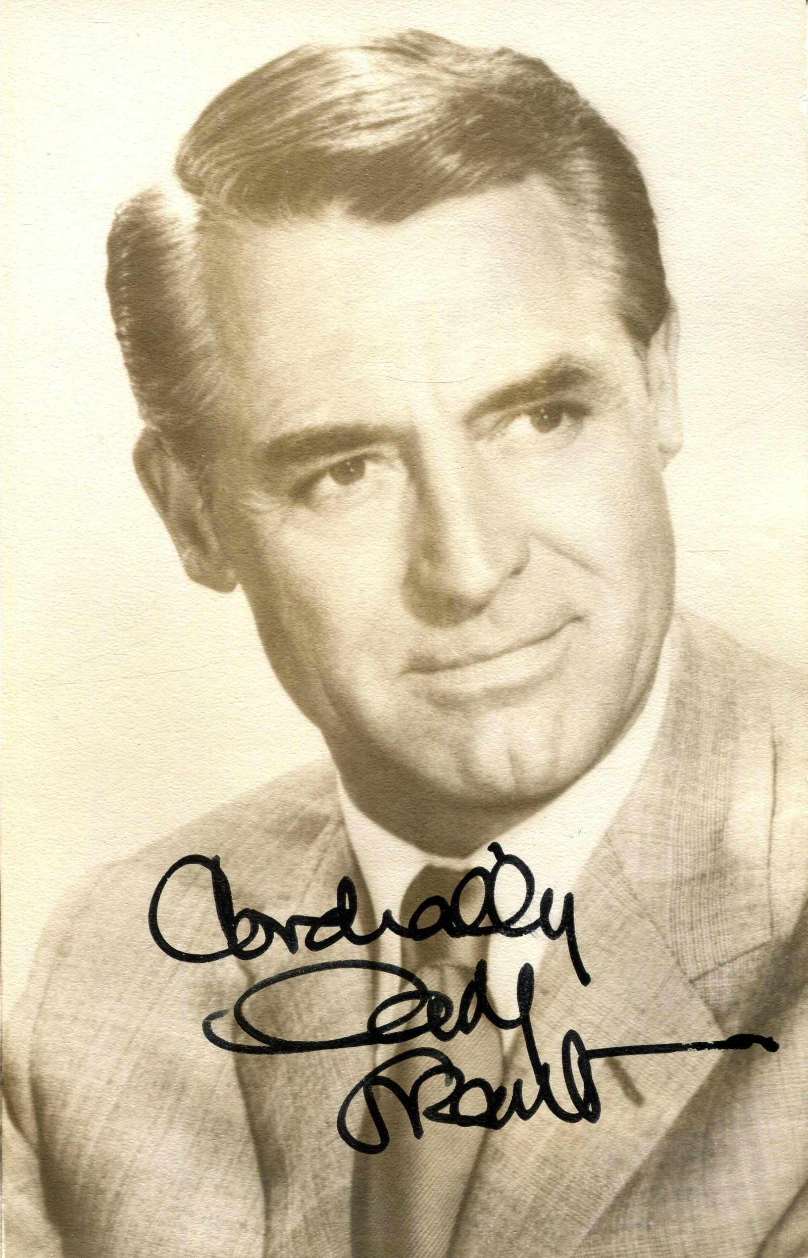 GRANT CARY: (1904-1986): GRANT CARY: (1904-1986) English-born American actor, the recipient of an Honorary Academy Award in 1970. Signed sepia 3.5 x 5.5 photograph of the handsome actor in a head and shoulders pose. Signed