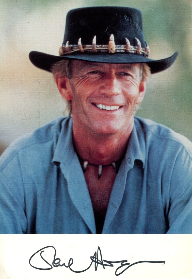 HOGAN PAUL: (1939- ): HOGAN PAUL: (1939- ) Australian Actor. Best known for his role as Michael in the film Crocodile Dundee, 1986. Colour signed 5 x 7 photograph, the image depicting Hogan in a head and shoulders pose,