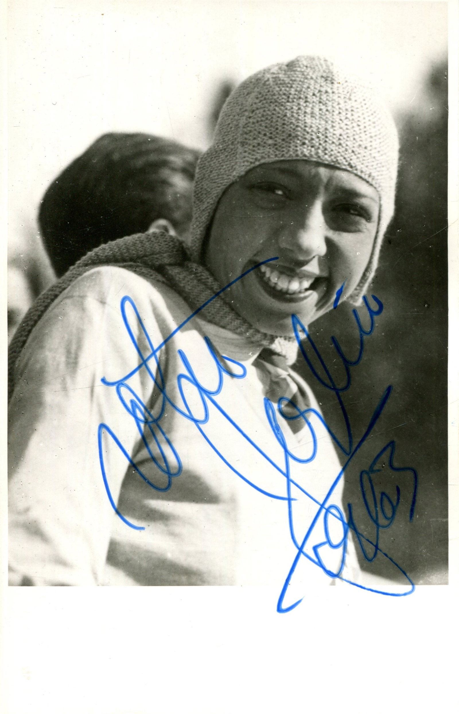 BAKER JOSEPHINE: (1906-1975): BAKER JOSEPHINE: (1906-1975) American-born French entertainer. Vintage signed 3.5 x 5.5 photograph of Baker in a smiling head and shoulders pose outdoors, wearing a knitted wool hat. Signed