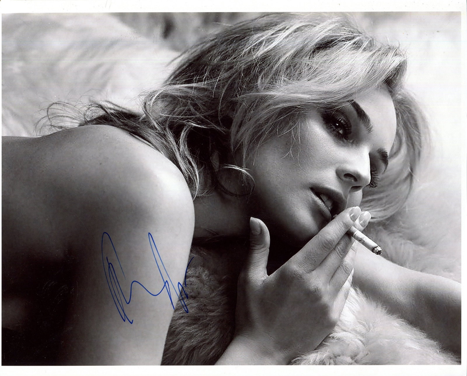 KRUGER DIANE: (1976- ): KRUGER DIANE: (1976- ) German actress. A very fine signed 10 x 8 photograph by Kruger, the artistic image shows the actress in a head and shoulders sensual pose, smoking a cigarette. Signed by Kruger