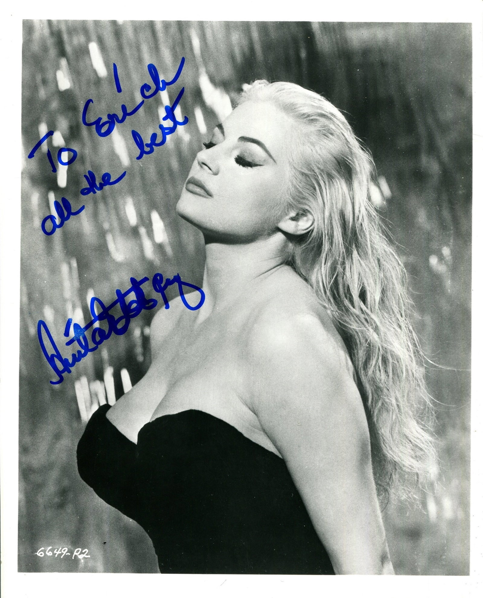 EKBERG ANITA: (1931-2015): EKBERG ANITA: (1931-2015) Swedish actress. A good signed and inscribed 8 x 10 photograph of Ekberg in a classic head and shoulders glamorous pose in costume as Sylvia Rank, with the Trevi Fountain to