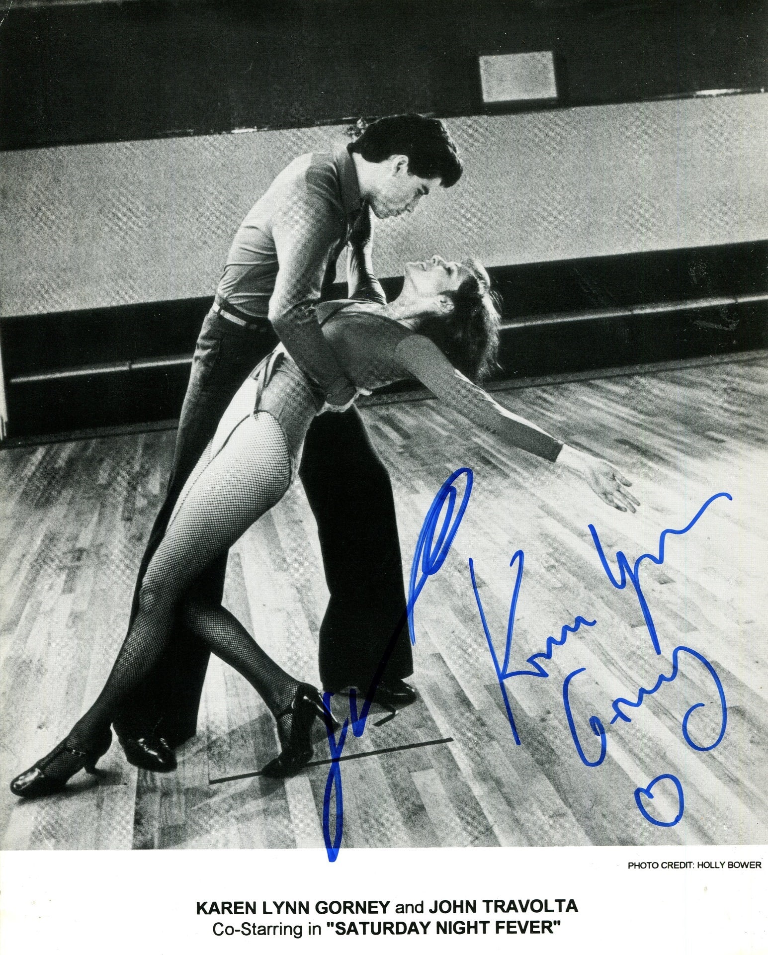 SATURDAY NIGHT FEVER:: SATURDAY NIGHT FEVER: Signed 8 x 10 cardstock photograph by both John Travolta (Anthony ´Tony´ Manero) and Karen Lynn Gorney (Stephanie Mangano) individually, the image depicting the two