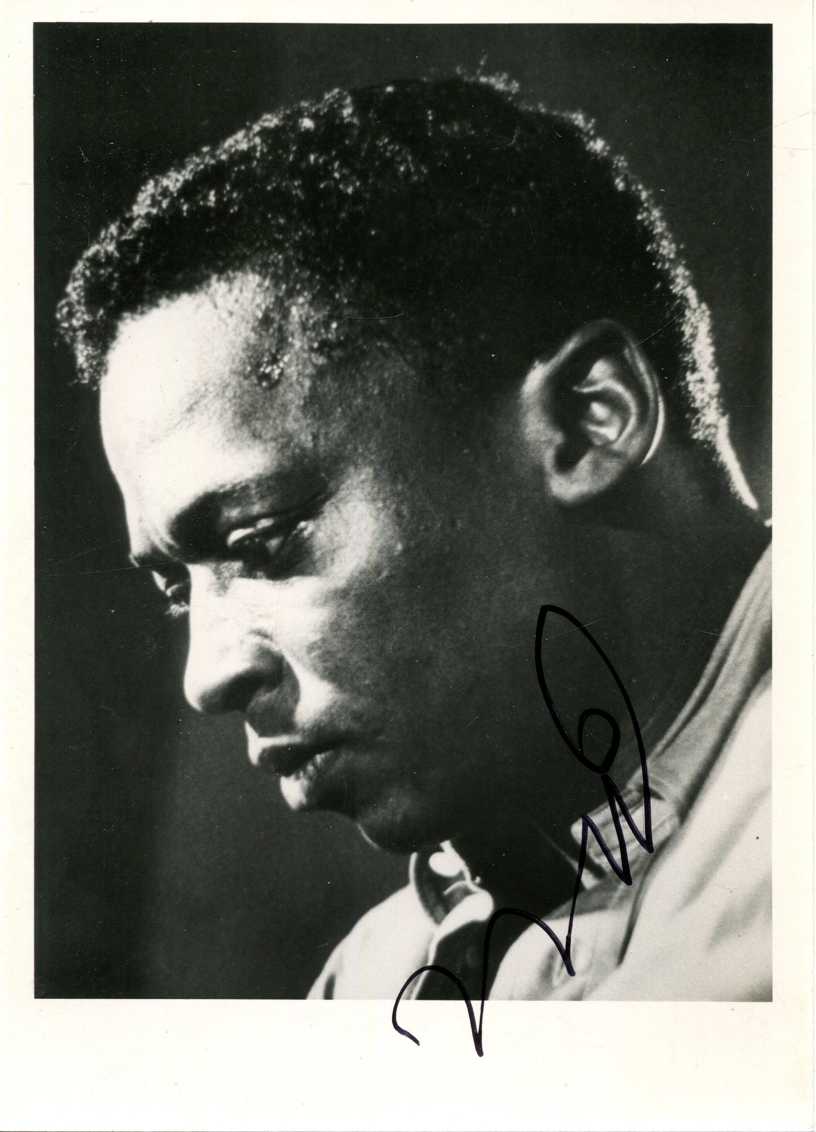 DAVIS MILES: (1926-1991): DAVIS MILES: (1926-1991) American jazz trumpeter. Signed 4 x 6 photograph of the pensive Davis in a close-up semi-profile head and shoulders pose. Signed in black ink with his initials only to the