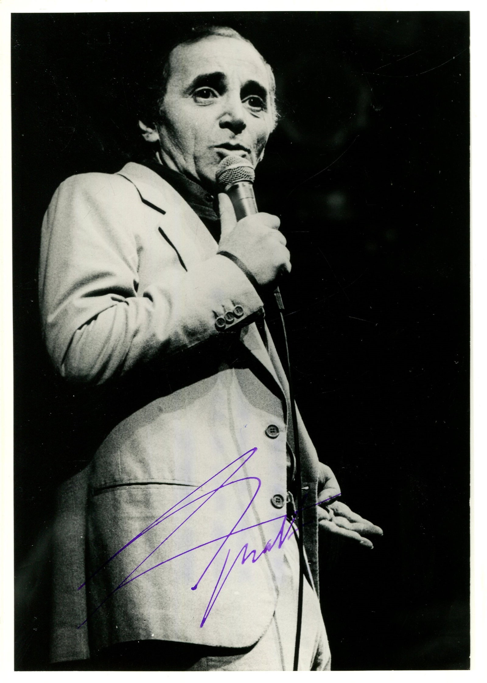 AZNAVOUR CHARLES: (1924-2018): AZNAVOUR CHARLES: (1924-2018) French Singer and Songwriter. A good signed 5 x 7 photograph by Aznavour, the image depicting the French artist standing in a three-quarter length pose during a