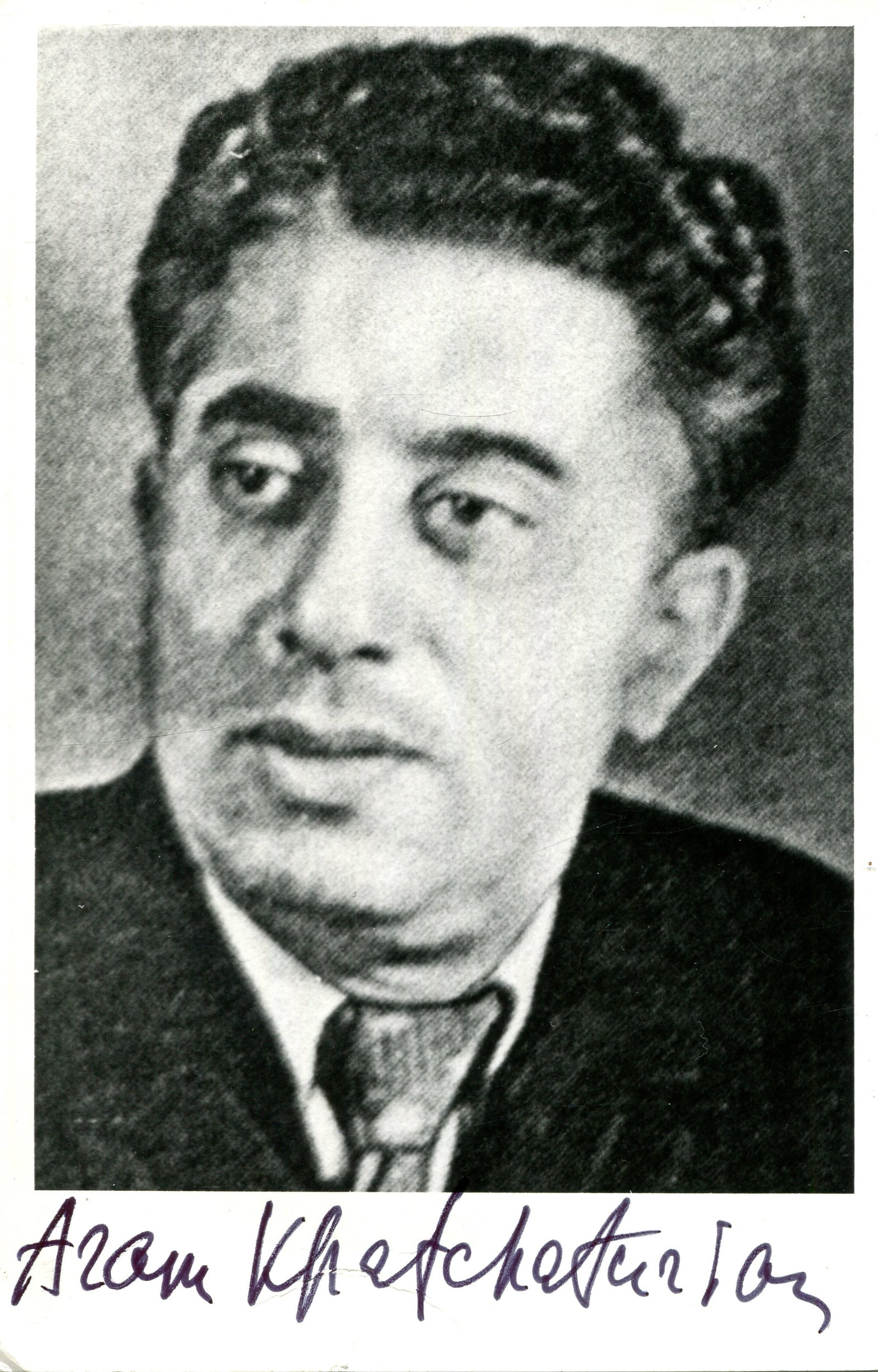 KHACHATURIAN ARAM: (1903-1978): KHACHATURIAN ARAM: (1903-1978) Russian Composer. Signed 3.5 x 5.5 postcard photograph, the image depicting a painting of Khachaturian in a head and shoulders pose. Signed in bold black ink `Aram