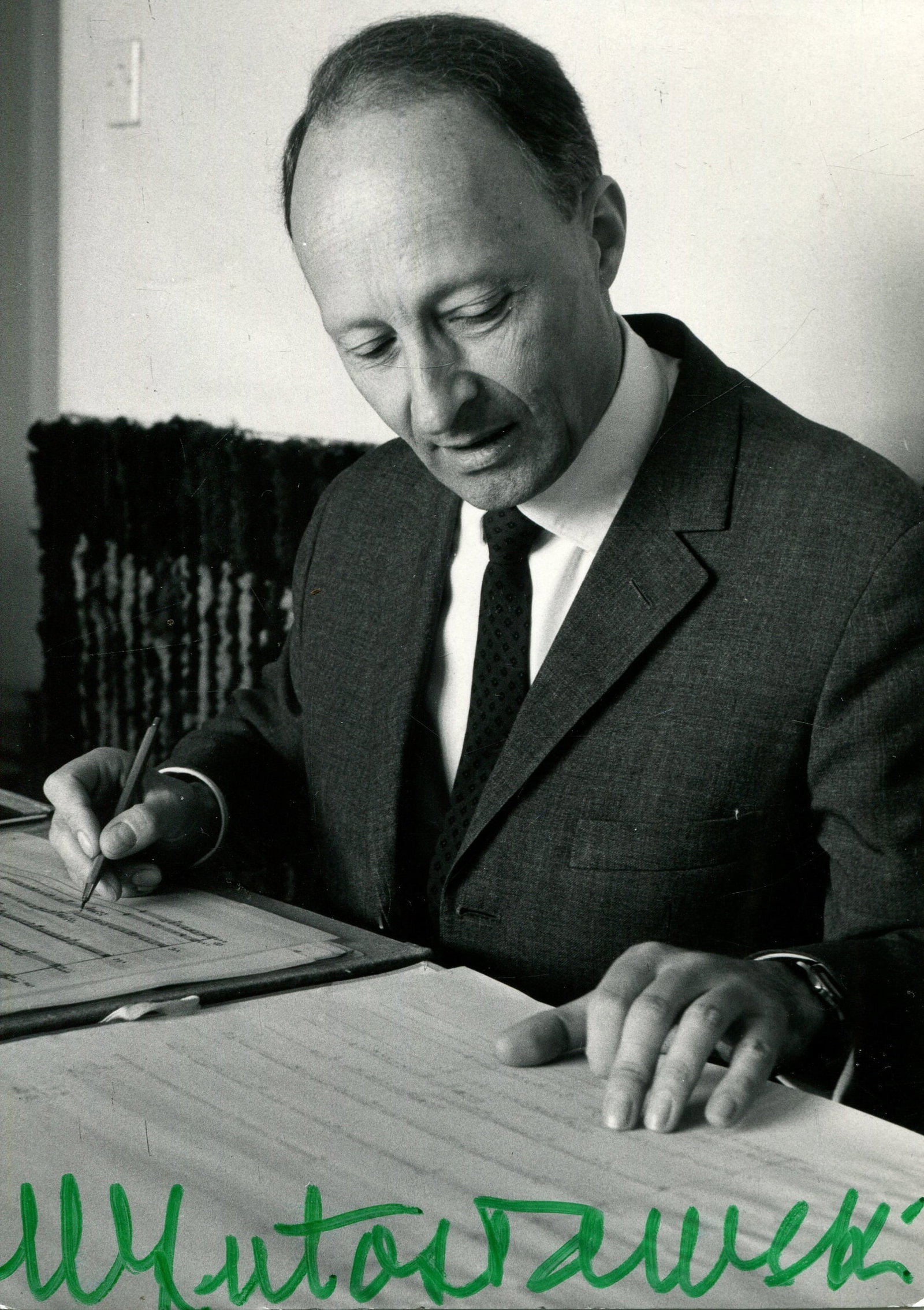 LUTOSLAWSKI WITOLD: (1913-1994): LUTOSLAWSKI WITOLD: (1913-1994) Polish composer and conductor. signed 4 x 6 photograph by Lutoslawski, the Zaiks image from Warsaw depicting the composer seated, working on a musical score, in a