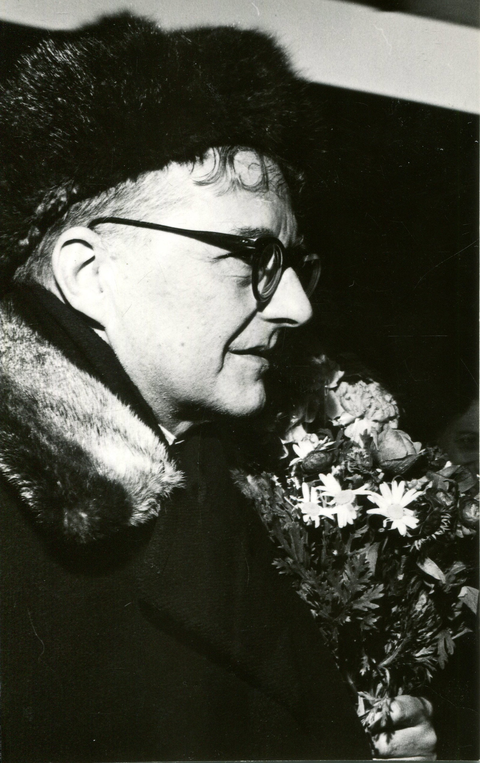 SHOSTAKOVICH DMITRI: (1906-1975): SHOSTAKOVICH DMITRI: (1906-1975) Russian Composer. Signed and inscribed 3.5 x 5.5 postcard photograph by Shostakovich, the image showing the Russian composer in a head and shoulders pose with a a fur