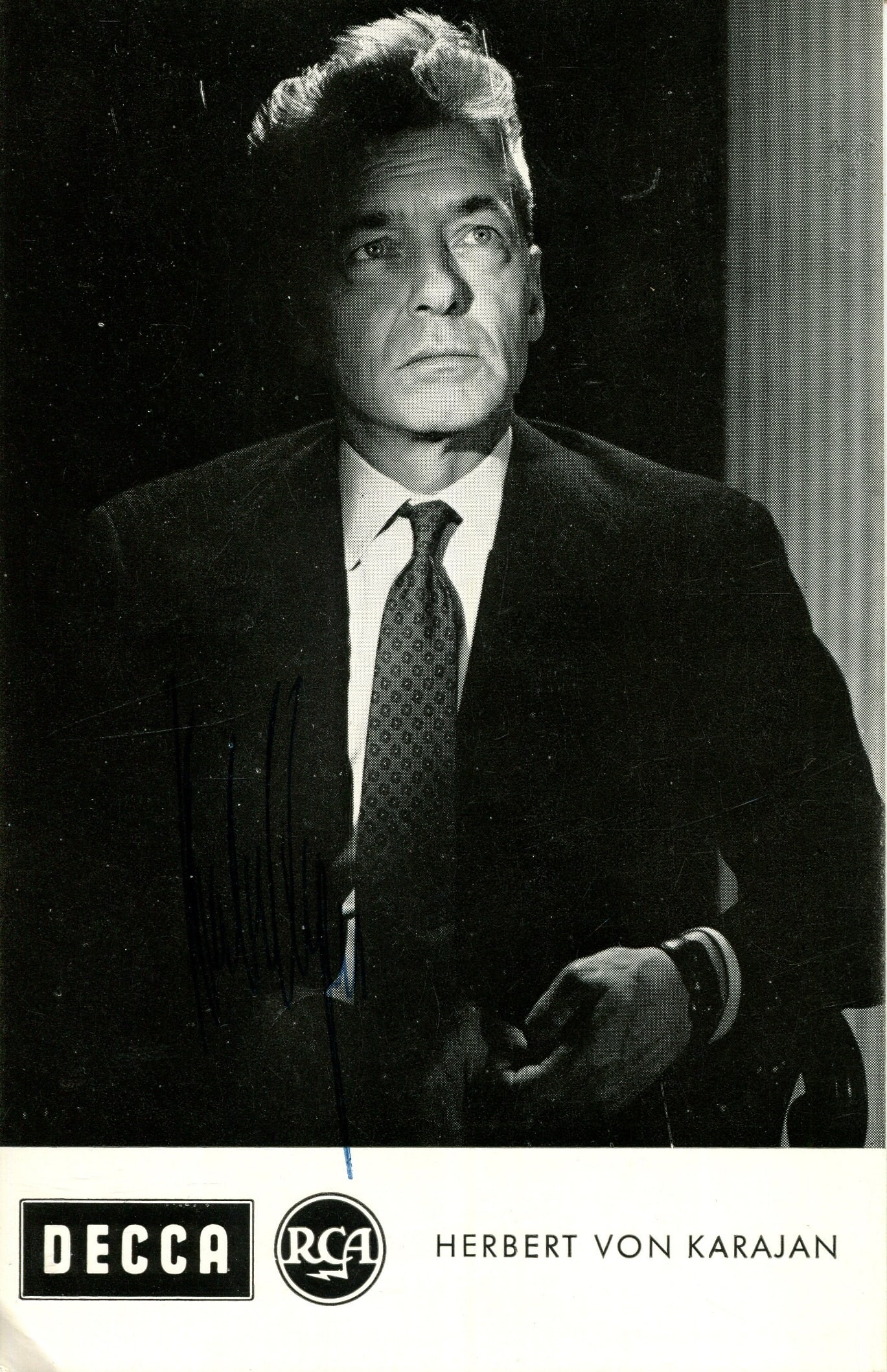KARAJAN HERBERT VON: (1908-1989): KARAJAN HERBERT VON: (1908-1989) Austrian Conductor. A very fine vintage signed 3.5 x 5.5 photograph, the promotional DECCA image depicting Karajan in a half-length pose. Signed in blue ink to a