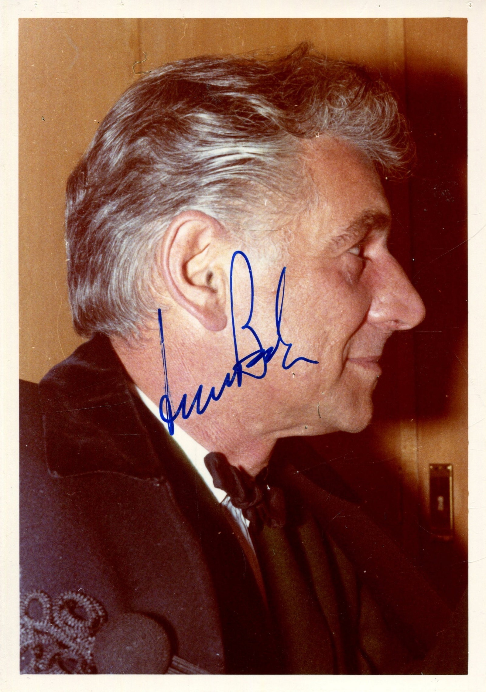 BERNSTEIN LEONARD: (1918-1990): BERNSTEIN LEONARD: (1918-1990) American Conductor & Composer of West Side Story (1957). Signed 3.5 x 5 colour photograph of Bernstein, the image depicting the conductor in a head and shoulders