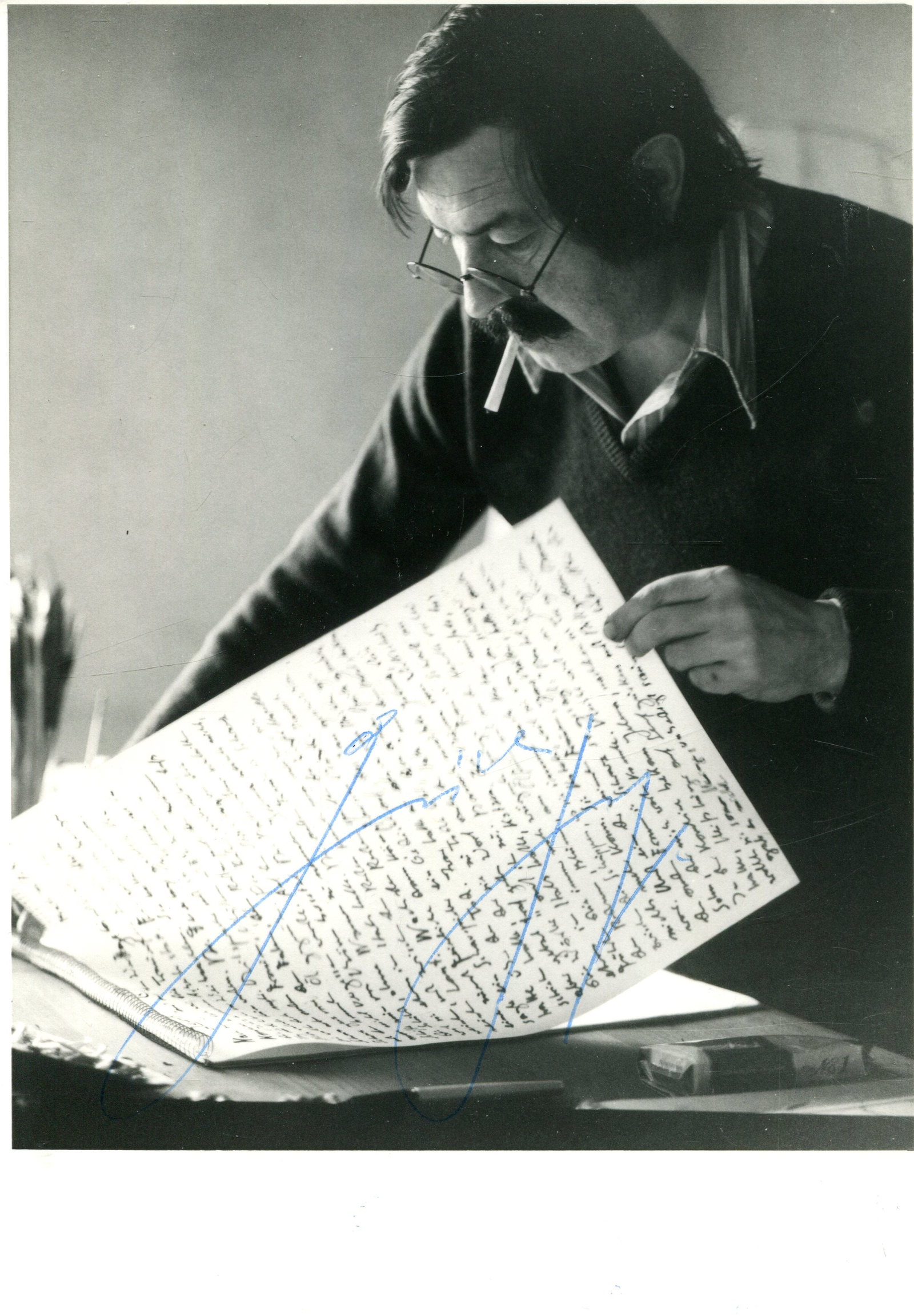 GRASS GUNTER: (1927-2015): GRASS GUNTER: (1927-2015) German novelist, poet and playwright, Nobel Prize winner for Literature, 1999. Signed 4 x 6 photograph of Grass standing in a half-length pose smoking a cigarette while