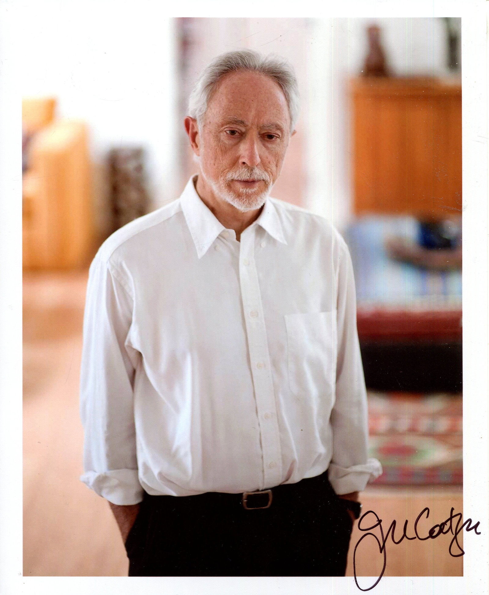 NOBEL PRIZE WINNERS: (x2): NOBEL PRIZE WINNERS: José Saramago (1922-2010) Portuguese writer, Nobel Prize winner for Literature, 1998. Signed colour 8 x 11.5 photograph of Saramago in a head and shoulders pose, holding a