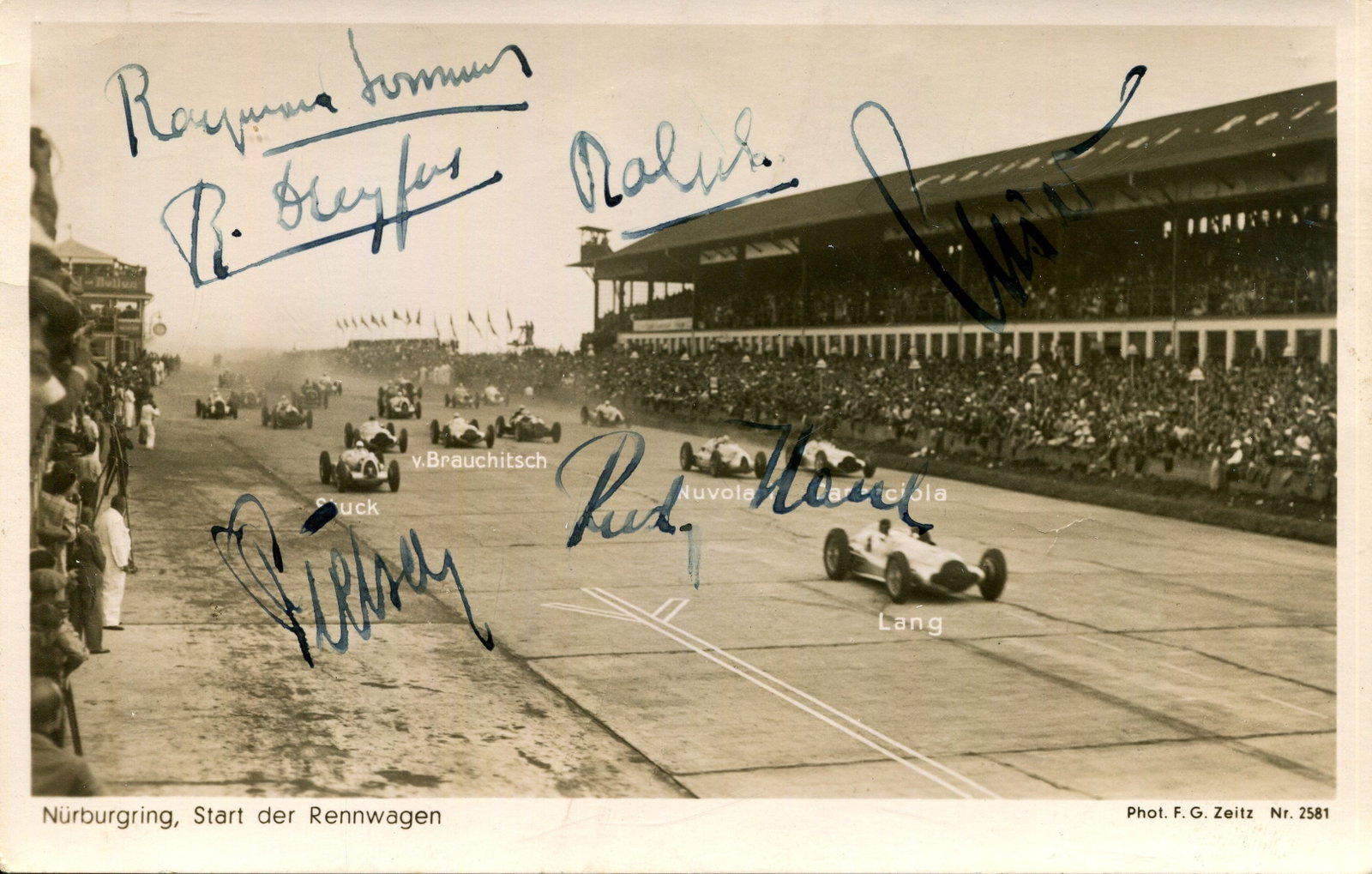 1939 GERMAN GRAND PRIX:: 1939 GERMAN GRAND PRIX: A rare multiple signed vintage postcard photograph by six motor racing drivers who participated in the German Grand Prix at the Nurburgring on 23rd July 1939 including Raymond