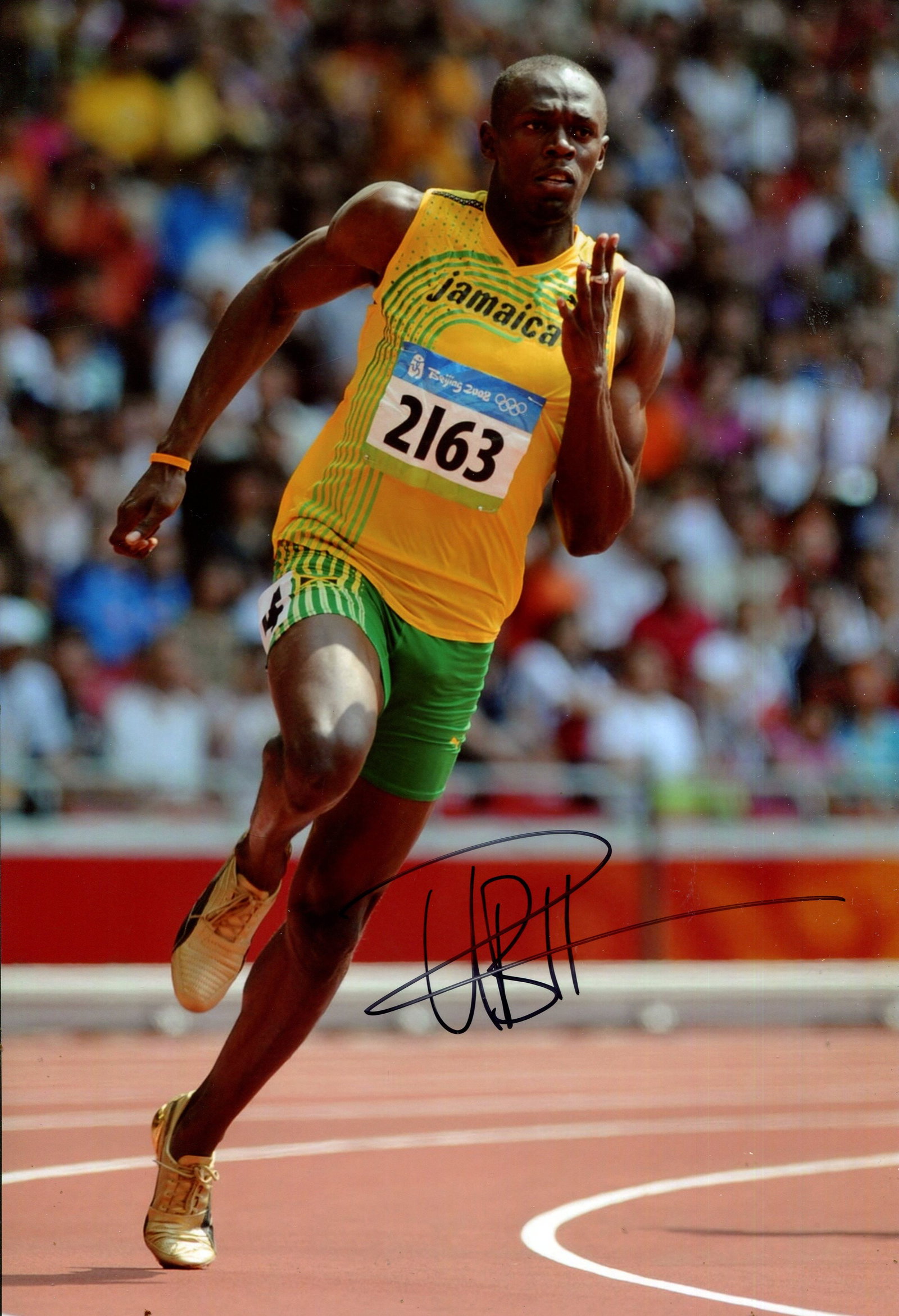 BOLT USAIN: (1986- ): BOLT USAIN: (1986- ) Jamaican sprinter, an eight-time Olympic gold medallist and eleven-time World Champion. Signed colour 8 x 12 photograph of Bolt in a full-length action pose sprinting on a