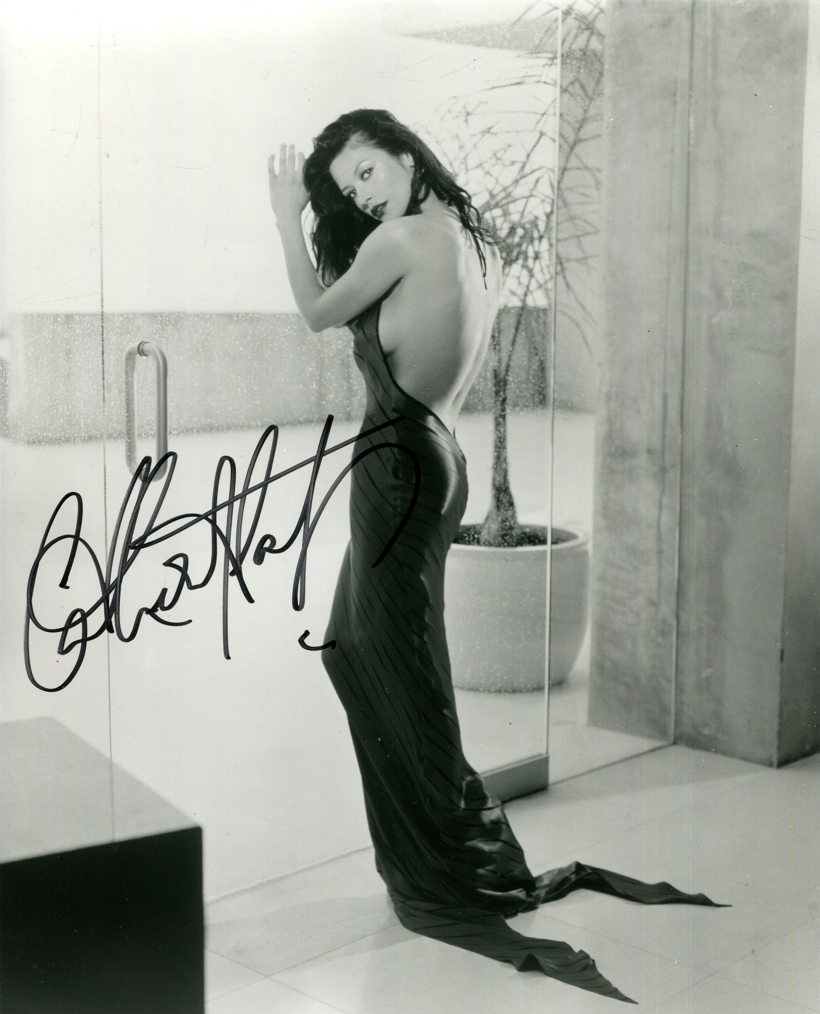 ZETA-JONES CATHERINE: (1969- ): ZETA-JONES CATHERINE: (1969- ) Welsh actress, Academy Award winner for Best Supporting Actress in 2002 for her role as Velma Kelly in Chicago. Signed 8 x 10 photograph by Zeta-Jones, the image