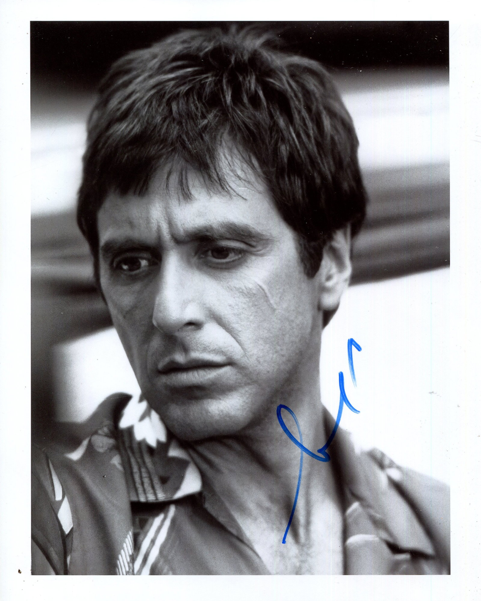 PACINO AL: (1940- ): PACINO AL: (1940- ) American Actor, Academy Award winner. Signed 8 x 10 photograph by Pacino, the image depicting him in a head and shoulders pose in costume as Tony Montana in a scene from the film