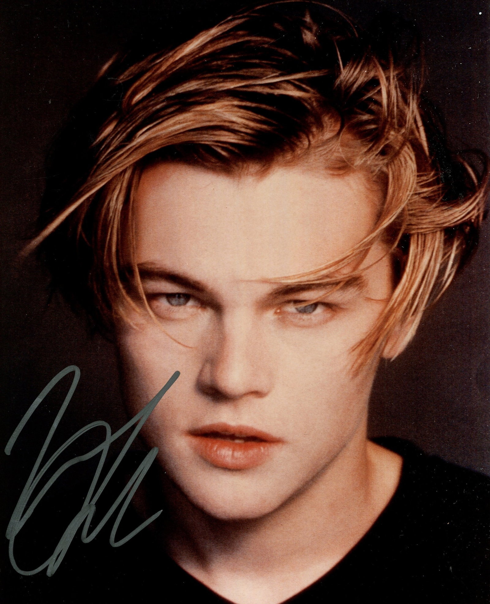 DICAPRIO LEONARDO: (1974- ): DICAPRIO LEONARDO: (1974- ) American actor, Academy Award winner for Best Actor in 2015 for his role as Hugh Glass in The Revenant. Signed colour 8 x 10 photograph of a young DiCaprio in a close-up